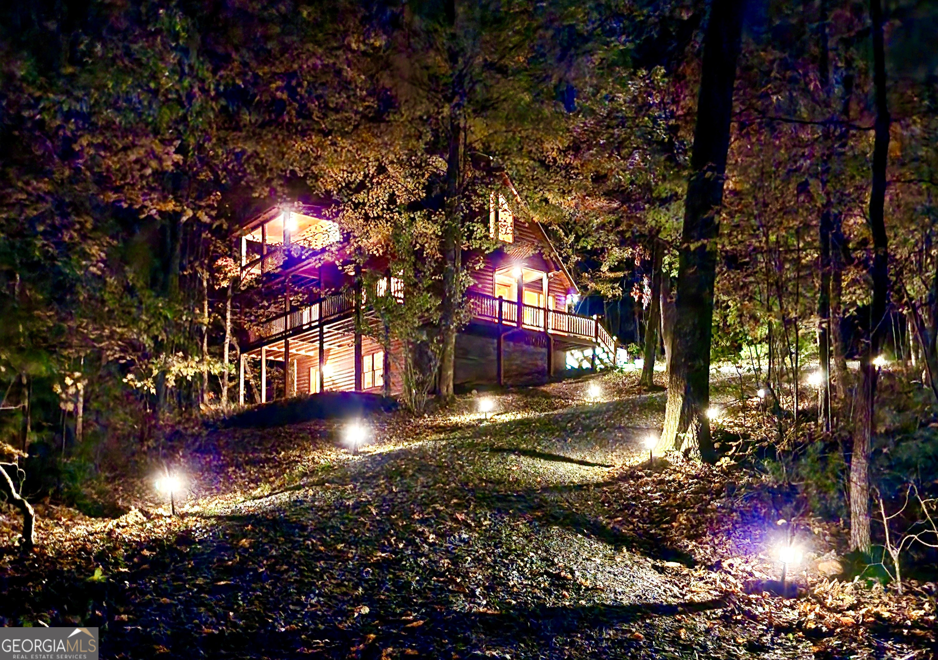 Appointment only! This gem, fondly named "Ruby," has a gated entrance, a lovely private driveway approach and a stunning evening appeal! Perfectly located, minutes to Mercier Orchards, Bear Claw Vineyards & Winery, and a 10 minute straight shot to the city of Blue Ridge. This "One Owner Home" is pristine inside and out with recent exterior staining and in excellent condition due to continuous spot-on maintenance and gentle use. "Ruby" is the perfect lock and go second home with a 90-minute travel time or less in non-peak traffic from Roswell, Alpharetta, Marietta, Sandy Springs, Chattanooga TN and more! It has a comfortable open floor plan with a separate Dining Room and a vaulted Great Room with a floor to ceiling wood burning Fireplace. Step out to relax or grill dinner on the full length, fully covered Rear Deck with beautiful mountain views to the North and West. The vaulted Owners Suite opens to its own Covered Porch with a peaceful long-range view. The generously sized En Suite Bathroom has a spa tub, separate shower and large walk-in closet with great storage and shelving. There is a cute Office/Zoom Nook on the 2nd level. The main level Guest Bedroom has French Doors to the Covered Deck. The Guest Bathroom can be entered from the bedroom or hallway and has a Tub/Shower Combo. There is a Laundry Room with a full-size washer and dryer plus added storage above. The full Unfinished Basement is stubbed for a bathroom with perfect potential for additional finished space to complete "your way!" It has both an inside and outside entrance with access to a walk-out patio. The Ring Security System includes Sensors on all doors, Motion Detectors and Smoke/Co2 detectors. The parking area can accommodate 4 vehicles. Two newer homes in the Million Plus range are two doors away in both directions. If you are looking for a mountain home with Super Easy Access from the main road, this is it! No curvy, winding, or super steep roads to challenge and no "thru-road traffic." You are at the end of a privately owned road. All appliances to remain. Modest monthly utilities with Tri State Electric, water supplied by Appalachian Water and internet service with ETC. Owner is the Listing Agent and a Licensed Real Estate Broker in the State of Georgia. APPOINTMENT ONLY! LOCKED ENTRANCE GATE AND SECURITY SYSTEM.