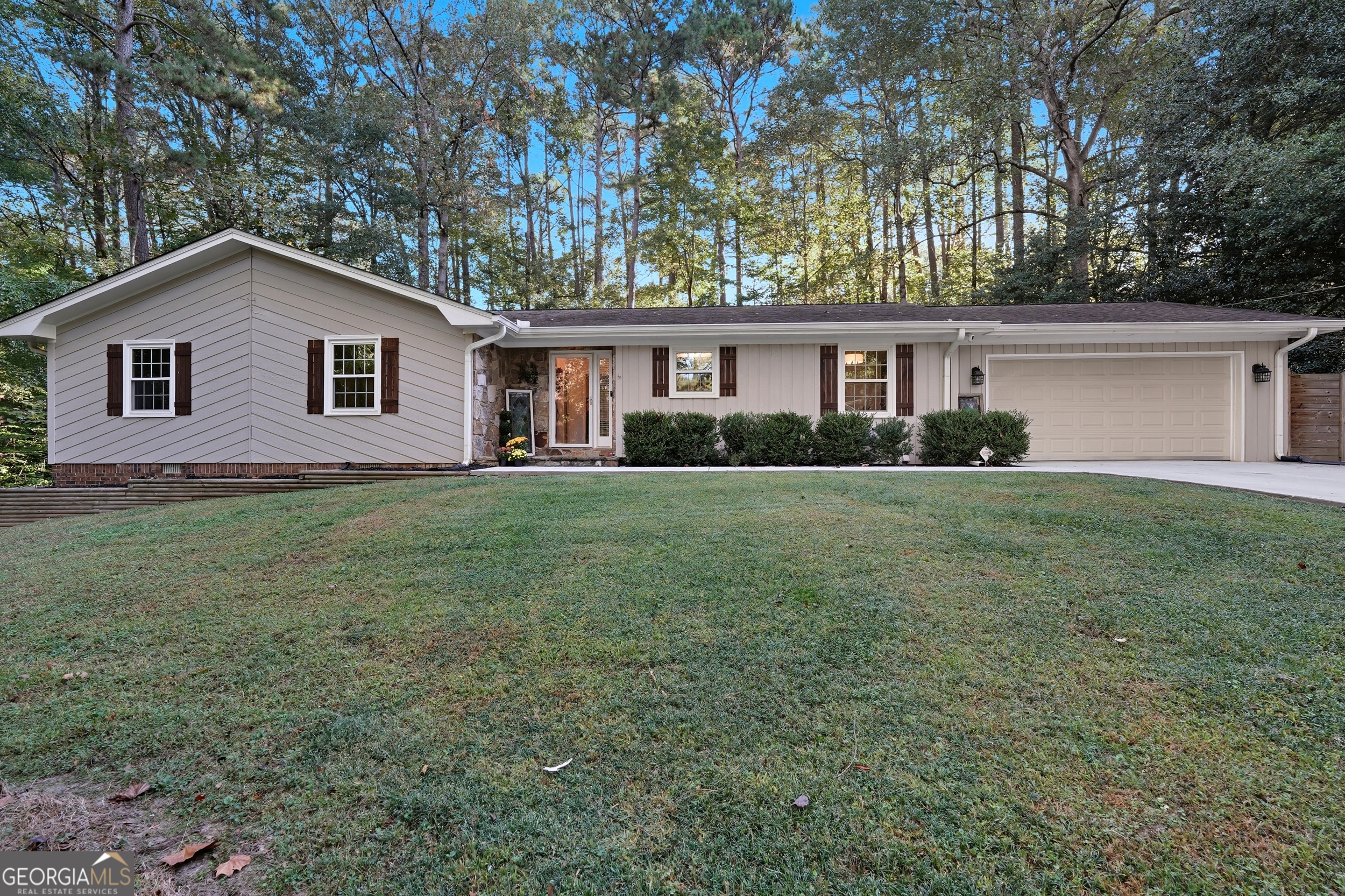 Beautifully Ranch Style Home Offering 2,100 square feet of living space with 3-bedrooms and 2-full bath, this property features a two-car garage and easy access to the Heart of Peachtree Corners! Great location in the highly sought after Simpson Elementary school district and perfectly blends comfort, style, and convenience. Recent updates include modernized bathrooms, new energy efficient windows, and engineered hardwood flooring throughout. Enjoy year-round living in the expansive sunroom, plus added peace of mind with a new water heater and fully encapsulated crawl space for improved efficiency and durability.The community has an optional swim and tennis membership, providing flexibility without the cost of a required HOA. Perfectly located just minutes from The Forum, Peachtree Corners Town Center, and I-285, you'll have shopping, dining, and entertainment right at your doorstep.