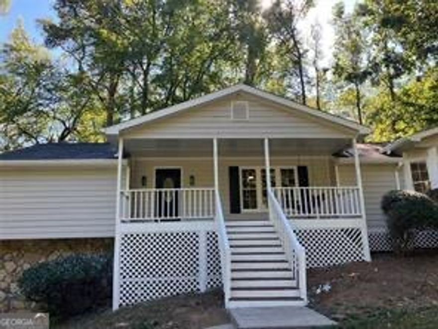 Prime Alpharetta location, top-rated schools such as Alpharetta Elementary, Northwestern Middle, and Milton High, and close to downtown Alpharetta and its fine dining and shopping opportunities. Established and Inviting community with an optional pool membership  but with no HOA. This home has 4 Bedrooms 2 Full Baths and 1 half bath.  Kitchen has white cabinets, beautiful stone countertops and stainless appliances. There is a large family room with a fireplace and 3 bedrooms on the main level, including the Primary on Main! The  flex space in the daylight basement with its own half bath and private exit,  can be used as a 4th bedroom, play room or office.  New paint inside and out, updated kitchen. There is a large unfinished room for storage or workshop in the basement. Enjoy the views of the large park like back yard  from your screened in porch