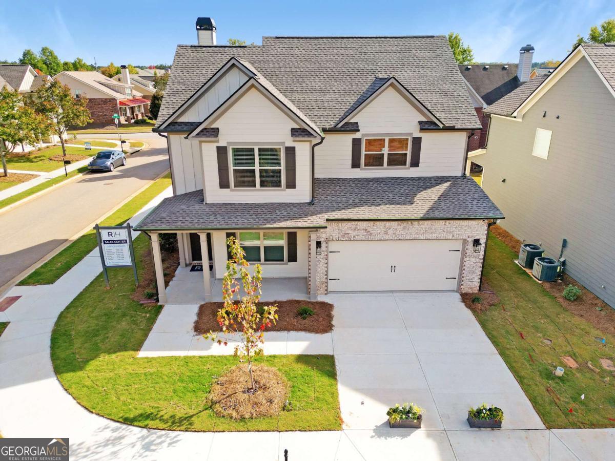 This Dylan A.1 Plan served as the Model Home for our Ridge Pointe Community. Its professionally decorated with beautiful furniture thats included with the sale. Some of the upgrades included are, Rev Wood flooring in the living areas, gourmet kitchen set up, quartz counter tops in kitchen, pendant lights over kitchen countertops, bricked fireplace to ceiling in Family Room, tiled master shower with frameless shower door in master bath, covered back porch just to name a few. This home sets on a corner lot and has extra windows, which brings in natural light, giving the home a vibrant, cozy energy thats can make any day relaxing. Located in Athens Ga, minutes from UGA, this home is a must see!