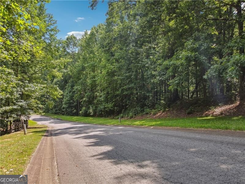 DO NOT DRIVE OR WALK DOWN DRIVEWAY AT 150 SHERWOOD. THAT IS PRIVATE PROPERTY. Discover the perfect location for your dream home in this non-HOA estate home mini-subdivision off of Trinity Church Road. This stunning 4.21-acre lot, filled with beautiful mature hardwood trees, offers an incredibly private setting on a quiet cul-de-sac street. The high and dry terrain varying from gentle slope to flat is ideal for building either a slab home or a terrace-level walk-out (basement) home. Bring your own builder and create the custom home you've always wanted! Zoned for Creekview High School, Creekland Middle School, and Macedonia Elementary. Conveniently located, Publix is just 5 minutes away, and both I-575 and GA-400 are easily accessible. Downtown Cumming, Downtown Canton, and Downtown Ball Ground are all within a 20-minute drive, while popular shopping/dining destinations such as Halycon Forsyth, Avalon Alpharetta, and Downtown Alpharetta are just 25 minutes away. Don't miss this rare opportunity to build your custom home in the highly desirable East Cherokee County. Enjoy the serenity of a private, wooded lot while being conveniently close to shopping, dining, and top-rated schools. Contact us today for more information and to schedule a viewing!