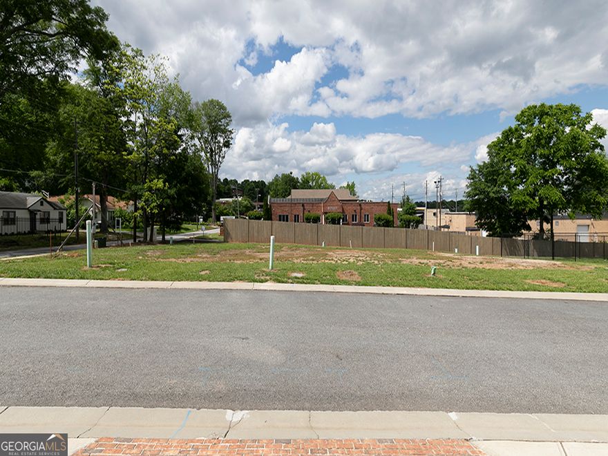 Don't miss this rare opportunity to own four ready to build townhome lots in one of Marietta's most vibrant and walkable neighborhoods! Just a short stroll to the Marietta Square, these lots are perfectly positioned near shopping, dining and public transportation in an established townhome community.