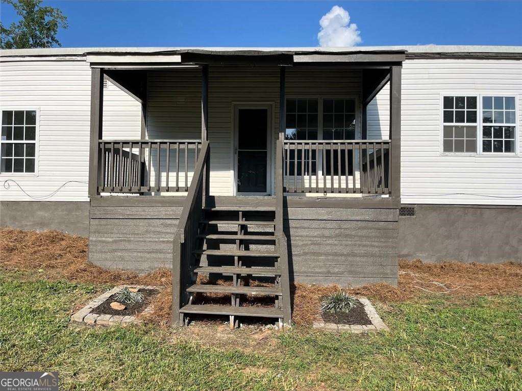 Come home to a spacious 4-Bedroom Home on Private 2+ Acreage in Villa Rica! (Rectangular shape lot for dimensions look up tax records) Welcome to 143 Raven Rd-this move-in ready charming 4-bedroom, 2-bath manufactured home offers over 1,800 square feet of living space nestled on a peaceful lot in the heart of Villa Rica. Originally built in 1968, the home has been fully renovated, fresh paint and floors throughout. Well-maintained and offers a functional layout perfect for families, investors, or those looking to enjoy the quiet of country living while staying close to town conveniences. Enjoy a large kitchen and dining area, generous living spaces, and ample bedroom sizes. The property offers plenty of room for gardening, outdoor entertaining, or expansion opportunities. With easy access to I-20, shopping, and dining, this is a great value for anyone seeking space, privacy, and potential. Spacious Shed located in property for handy man tools or any projects Property sits on a permanent crawl space foundation, titles have been retired. Could possibly go FHA Don't miss out-schedule your showing today!