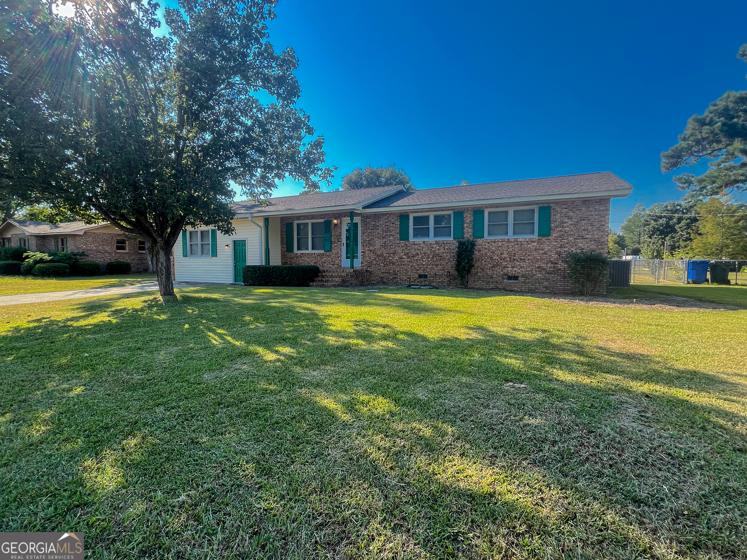 Fresh updates, smart upgrades, and a fantastic layout make 404 Eastwood Drive a home you'll love coming back to. Offering 3 bedrooms and 3 full baths, this brick home features an enclosed garage transformed into a spacious family room with soaring ceilings, built-in shelving, and plenty of room for a TV lounge and game area. Inside, you'll find fresh paint throughout, giving every room a bright and welcoming feel. The kitchen shines with new cabinets, countertops, LVP flooring, and a brand-new stove, flowing easily into the dining area and out to the deck through new double doors. Overlook the large fenced backyard-perfect for gatherings, pets, or playtime. A beautifully tiled shower enhances the guest bath, while the primary bedroom includes its own full bath for privacy. With practical updates like a 2-year-old HVAC, roof and water heater (7-8 years), electrical upgrades (2016), and new vinyl across the front, you'll enjoy peace of mind for years to come. A storage building adds extra convenience. All this in a great location just minutes to shopping and dining-don't miss this move-in ready find!