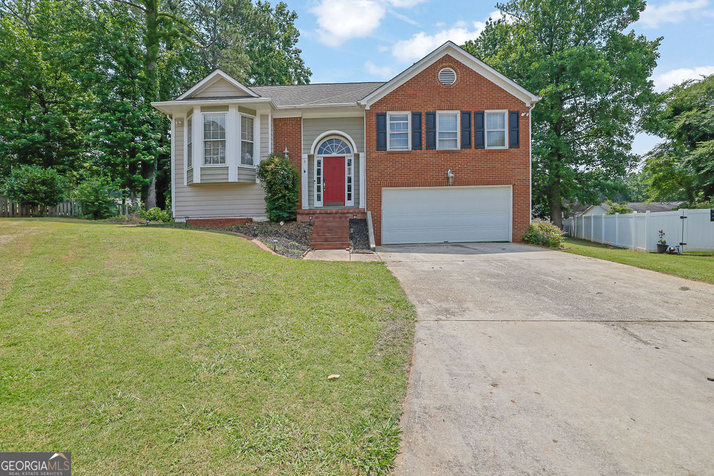 Located on a quiet cul-de-sac in the desirable River Colony North subdivision in Lawrenceville, GA, this spacious 5-bedroom, 3-bath home offers 2,675 square feet of finished living space and is situated on a fenced 0.28-acre lot. Built in 1989, the home has been thoughtfully updated, featuring new flooring and fresh paint on the main level, a 3-year-old HVAC system, and a 2-year-old water heater. Upon entry, you're welcomed into a generously sized family room with a cozy fireplace, perfect for gathering. The large eat-in kitchen features brand-new appliances and plenty of room for everyday dining. A separate dining room offers versatility and can also serve as a home office. The main-level primary suite includes a double vanity, separate tub and shower, and ample closet space. Two additional bedrooms and a full bath round out the main floor. The lower level is ideal for multi-generational living or rental potential, boasting a full in-law suite complete with its own kitchen, two bedrooms, a full bath, and a spacious living area. The terrace level opens to the private, fenced backyard, perfect for outdoor relaxation and entertaining. Neighborhood amenities include a community pool and tennis courts. Conveniently located near Collins Hill schools, shopping, and with quick access to I-85, this home offers the perfect blend of comfort, functionality, and location. Don't miss this opportunity-schedule your showing today!