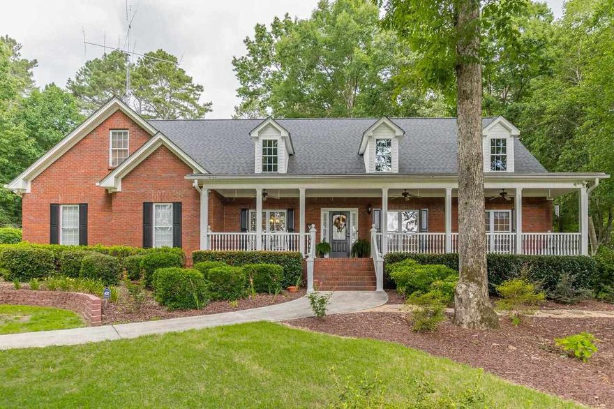 Beautiful property is just outside the hustle and bustle but still close enough to get to shopping and dining in just a few minutes. All brick ranch home on 4.54 acres. The gentle flowing small creek will provide a gentle song as you relax on the rocking chair front porch and enjoy the views. As you step inside you are greeted with all the southern charm one home can offer. The country kitchen provides a wonderful space to gather family and friends. Open the double doors that lead to the all seasons room for even more space for large gatherings. The ginormous pantry provides storage for small appliances and groceries for big and small crowds. Then continue into the beautiful great room with gleaming hardwood floors and a beautiful fireplace. This space is large enough to accommodate plenty of furniture. The owner's suite is fabulous! The bedroom is huge and has a sitting area. The owner's bath features his and her vanities, separate tub and shower as well as oil rubbed bronze fixtures. There are two additional bedrooms connected by a Jack and Jill bath at the other end of the home. Upstairs is another bedroom and full bath. There is an outbuilding and a shed on the property. Don't miss this little piece of paradise.
