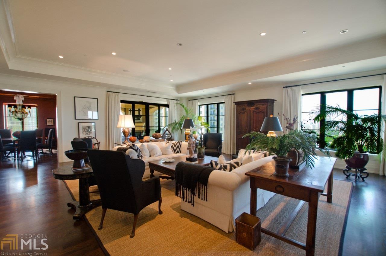 Exceptional and sophisticated in the prestigious St. Regis Residences. In the heart of Buckhead with impressive views of downtown and overlooking all of Atlanta's trees! Private elevator opens to grand living space with unobstructed panoramic views. Custom features include 10.5' ceilings, paneled dining room with bookcases, large living room built-ins and beautiful hardwood floors, and a large outdoor space with fireplace that is accessible from living room and dining room. As a bonous this space has electronically controlled screens for year-round pleaslure. Residents will enjoy the spectacular amenities of the St. Regis, including a dedicated, award winning residential concierge team, the 40,000 square foot pool piazza, state of the art Athletic Club, a full service spa, an on-site hair salon, the celebrated Atlas restaurant and the beautiful Garden Room. Enjoy the world class service, amenities and convenience of the St. Regis.
