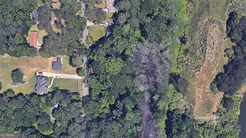 "Rare Find in Fulton County! Discover the perfect blend of privacy and convenience with this 0.57-acre buildable lot tucked away on a peaceful cul-de-sac in Atlanta. Enjoy the serenity of country living-just 15 minutes from the heart of downtown. This prime lot features city water and public sewer access, making it ready for your dream home or next investment project."