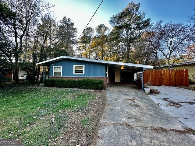 This wonderful 2+ bedroom, 1 bathroom, ranch style home offers a lovely retro vibe. Featuring hardwood floors throughout this home including a living room, dining area, kitchen which is equipped with an electric cooktop, wall oven, refrigerator, dishwasher and breakfast bar, 2 bedrooms, plus a bonus room which would make a great office space or guest room and 1 bathroom. The outside of this home is made for entertaining. Including a gravel seating area and fenced backyard with a cozy firepit. A 1 car carport with laundry room completes this lovely home. Don't miss out. Call today to schedule a viewing. Excalibur Homes does not advertise on Facebook or Craigslist. Be advised that the sq ft and other features provided may be approximate. Prices and/or availability dates may change without notice. Lease terms 12 months or longer. Application fee is a non-refundable $75 per adult over 18 years of age. One-time $200 Administrative fee due at move-in. Most homes are pet-friendly. Breed restrictions may apply. Rental insurance required.