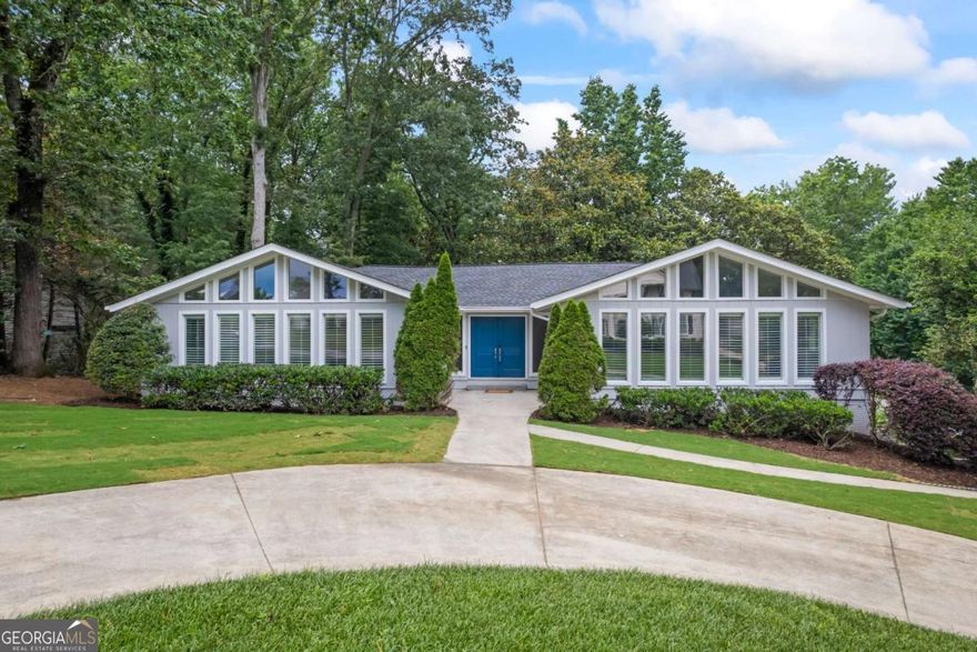 This beautifully updated home in the sought-after Wheeler High School district offers 4 bedrooms and 2.5 bathrooms on the main level, plus a fully finished basement with an additional living room, storage room, rec room, and workshop plus a bedroom and full bath-ideal for in-laws, guests, or a private office space. Situated on a landscaped corner lot in a well-maintained swim community with pool, clubhouse, sidewalks and a swim team, this home has been thoughtfully renovated throughout. The bright white kitchen features quartz countertops, stainless steel appliances, a navy tile backsplash, and opens to a sunny breakfast area. The large pantry, half bath, and laundry are all convenient to the kitchen, perfect for those who entertain. Plantation shutters throughout add a high end touch along with the solid wood doors in every room and closet. Two fireplaces provide cozy gathering spots-one in the vaulted living room with exposed beams and another in the basement level. The primary suite includes a spacious walk-in shower and double vanity. Enjoy the private backyard with room to relax or entertain on the large deck. Conveniently located near parks, shopping, and major highways, this move-in ready home combines style, space, and location.