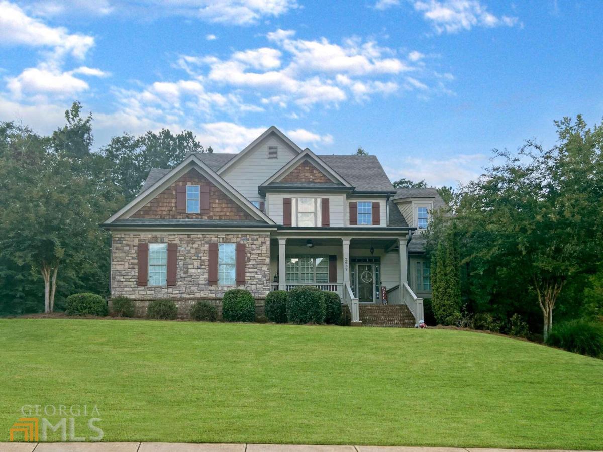 FANTASTIC HOME with finished basement in the AMAZING NORTH OCONEE SCHOOL DISTRICT!! As you enter this awesome Morningside home you will notice the attention to detail with moldings and the site finished hardwood floors that flow thru all of the public living spaces on the main level. The Family Room is straight ahead and has a tall vaulted ceiling and fireplace. Just around the corner is the chefs Kitchen with stunning cabinetry, granite countertops, tile backsplash, 2 pantries, stainless steel appliances including a gas cooktop and double ovens. The kitchen overlooks the charming Keeping Room space. The laundry room is conveniently located between the kitchen and garage entry. On the opposite end of the main level is where we find the Master Suite. The Master Bedroom is generously sized and features a trey ceiling. From the Master Bedroom you will pass the large walk-in closet just before entering the master bathroom. Here you will immediately notice the large soaking tub, separate tiled shower and the two granite topped vanities. The upstairs of the home has lots of space... At the top of the stairs you will find the loft area with built-in desk center. Perfect for homework or home office! There are 3 generously sized bedrooms here, one with a private bath. Another full bath (jack n jill) connects the two remaining bedrooms. A walk-in attic storage space is located just off a closet in an upstairs bedroom. The basement was just finished in 2020 and includes a full kitchen, eating area, media room, full bath & flex room (currently used as a bedroom) There is also amazing storage found in the basement including an area for outdoor tools/lawn equipment which has an overhead door. Fenced back yard!! Don't miss this great property!!