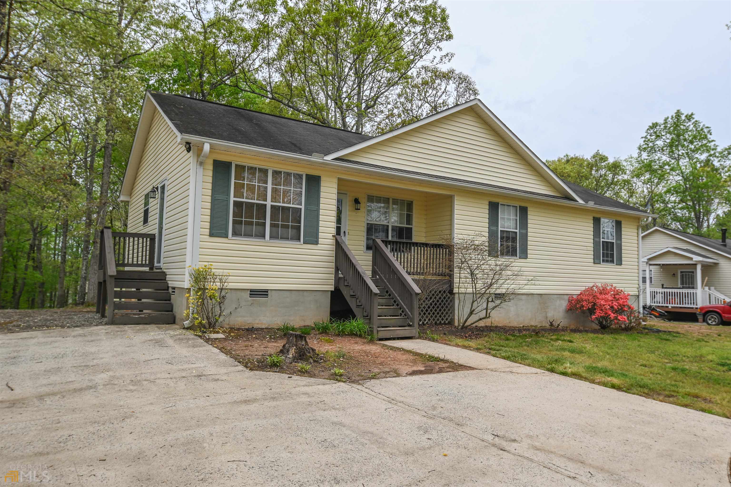 Located only five miles from downtown Athens and the University of Georgia but with peace and quiet. If you love the woods and wildlife and serene countryside living, this is the place for you. Enjoy a relaxed evening on the double-deck outback. The home is extremely clean and bright with complementary colors in all rooms. A spacious kitchen and breakfast/dining area features upgraded light fixtures and off the kitchen a large pantry laundry room. Recessed lighting over showers and in some of the spacious closets. Closets feature wide closet doors for easy access. All bedrooms are large and have ample space in closets. And now a message from the owners: "When we moved into our home several years ago, we immediately fell in love with the neighborhood. The neighborhood is quiet and peaceful. It is a great place to take walks with our dog or let our toddler try out his new tricycle, and everyone drives safely as many kids spend time out playing in their yards and riding their bikes. We love the openness of our home which includes lots of room for great storage in the closets, laundry room, and shed outback. Our home is surrounded by many trees that provide incredible shade in the summer and perfect spots to hang up a hammock and enjoy the beautiful spring and fall weather. The front and back yard provides lots of space for our dog and son to run and play and explore. The location is also about five minutes from downtown and very close to the Loop to make getting around Athens quick and easy. We also have incredible sweet and kind neighbors that you will enjoy getting to know in your new home." Looking to sell your home? Get an Instant Home Value at MyResidenceSold.com