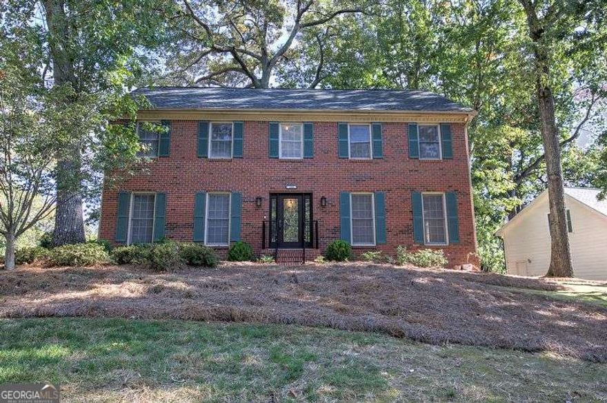 Charming Brick-Front Traditional in Sought-After Spring Ridge Subdivision, Roswell's Premier Swim/Tennis Community!    Welcome home to this spacious and beautifully maintained traditional brick-front residence located in the heart of the highly acclaimed Roswell school district. Nestled in the vibrant and amenity-rich Spring Ridge neighborhood, this home offers the perfect blend of elegance, comfort, and community lifestyle.    Step inside to discover a fantastic layout designed for both everyday living and entertaining. The main level boasts an oversized formal living room, separate dining room, and a cozy family room with built-in bookshelves and fireplace, adjacent to a wet bar creating the deal place for hosting guests. A sun-drenched sunroom overlooks the beautifully landscaped backyard and opens onto a large back deck, perfect for outdoor dining or relaxing.    The updated kitchen features granite countertops, stainless steel appliances, an abundance of cabinetry, and multiple pantries and closets for storage. Adjacent to the kitchen is the breakfast area with lots of windows.    Upstairs, you'll find spacious bedrooms, a centrally located laundry area, and an expansive owner's suite with dual vanities, an oversized walk-in closet, and additional closet space.    Spring Ridge offers resort-style amenities, including:    A junior Olympic pool, diving pool, and baby pool with lifeguards and a summer swim team    Four lighted tennis/pickleball courts with active ALTA leagues    Clubhouse, available for private rentals    Playground, wooded walking trails, and a lush park setting    A fun-filled social calendar with seasonal parties and neighborhood events    All just 1.5 miles from GA-400 and minutes to downtown Roswell, Alpharetta, Johns Creek, Avalon, Big Creek Greenway, and top-rated public and private schools.    This home has been lovingly cared for by original owners and is now ready for its next chapter. Don't miss this incredible opportunity to live in one of Roswell's most desirable communities. Schedule your showing today!