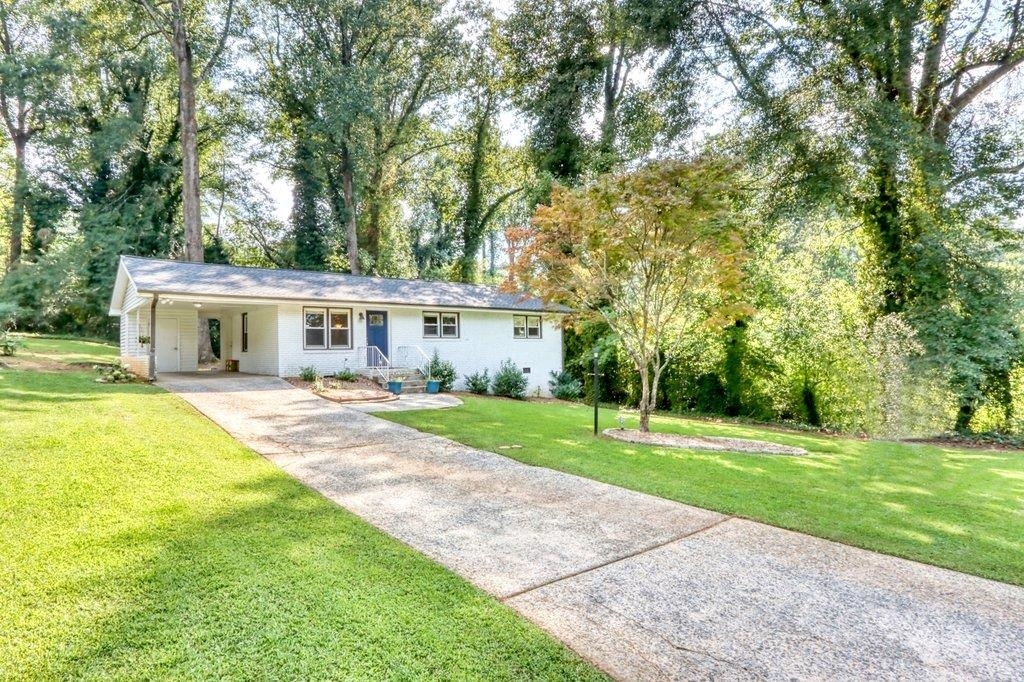 You do not want to miss this charming home in one of Smyrna's fastest growing areas. Just a short drive from the Smyrna Market Village, The Battery, and many retail and restaurant options, this ranch recently renovated in 2018 is the perfect home for you to get started. With beautiful natural light, a large patio and lovely large, level lot for entertaining, and beautiful hardwoods throughout you'll feel right at home. Won't you come visit us at Pineland?