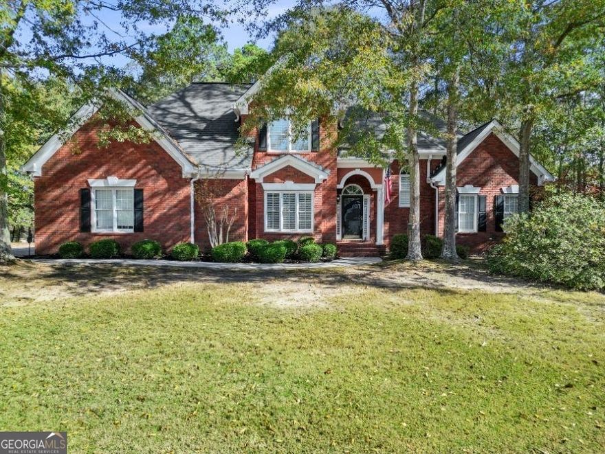 This 4-bedroom, 2.5-bathroom two-story brick home in Fayetteville offers over an acre of space and a host of great features. The main level features LVP flooring installed in 2020, a two-story foyer, family room with a fireplace, formal dining room, powder room, laundry room, and kitchen with granite counters, tile backsplash, breakfast bar, eat-in area, pantry, and stainless steel appliances. The Owner's Suite on the main level includes a tray ceiling, a walk-in closet, and an en suite bathroom with tile floors and shower, dual vanity sinks, and a water closet. Upstairs, you'll find 3 more spacious bedrooms that share a full hall bathroom with dual vanity sinks. The home also comes with a clothes washer and dryer and a Ring Security Camera. Situated on a corner lot, the property features an irrigation system in the front and back yard. The sellers are offering a $5,000 carpet/paint allowance at closing, making this an even more appealing opportunity. Schedule your showing today!