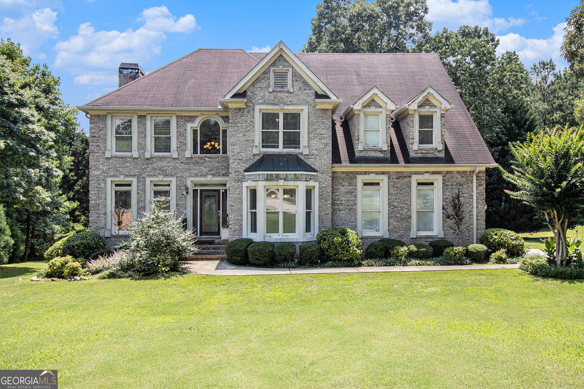 Beautiful home in sought-after Chapel Hill subdivision! This home is priced to sell with a stunning finished basement that has a custom bar, fireplace, and walk out doors to the back yard. This spacious home has a separate dining room, family room, laundry room, and living room which blends comfort with luxury. 4 Bedrooms and 3.5 bathrooms with 2 additional bonus rooms for a office and gym. The deck oversees the level large back yard, and the kitchen has granite and a stainless refrigerator. All 17 homes in the enclave are custom built with high end finishes with almost an acre land. Close to shopping, top schools, restaurants, and easy assess to expressway.