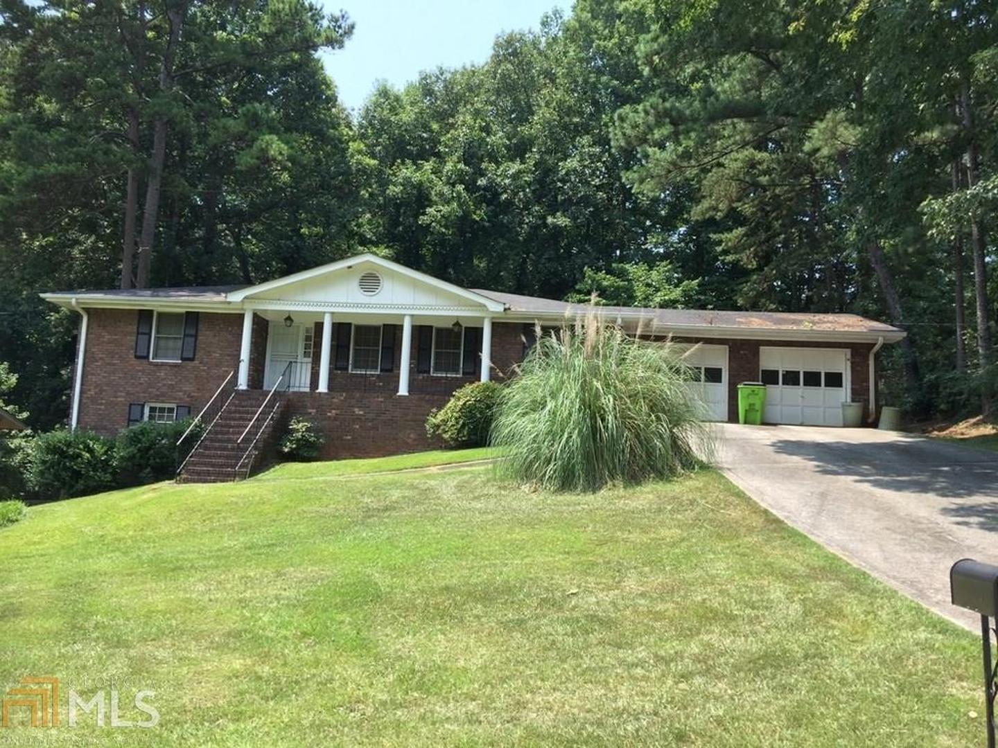 Beautiful 4-sided brick 4BR-3BA ranch on a full finished basement. Home has separate living and dining rooms. Over-sized family room with brick fireplace. Huge basement area with another bedroom, full bathroom and extra large entertainment room with bar area and brick fireplace. Home is nicely situated on large lot. Walking distance to MARTA and park. TLC needed. Investor's paradise!