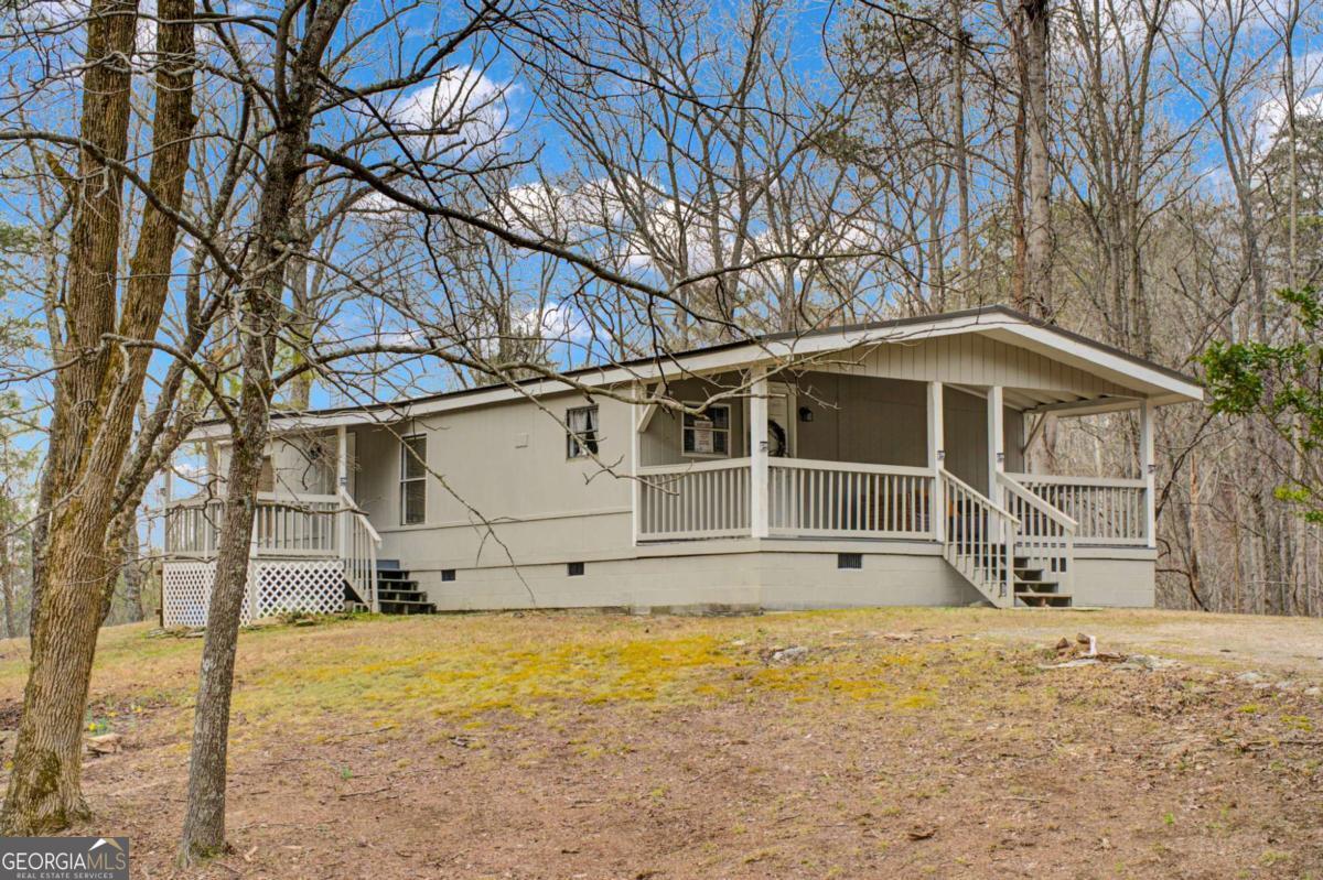 3.92 Acre Lot with an amazing water feature out back. Home was recently remodeled in 2021 and has been a long term rental. Come see what Talking Rock Creek Resort has to offer you! Conveniently located in between Atlanta and Chattanooga! In close proximity to the Apple Houses, Wineries, Hiking, Carters Lake, and so much more! Amenities include two pools, Fishing lake, Creek access, Small gym, Rec Room, Trout Lodge, Trails, etc.