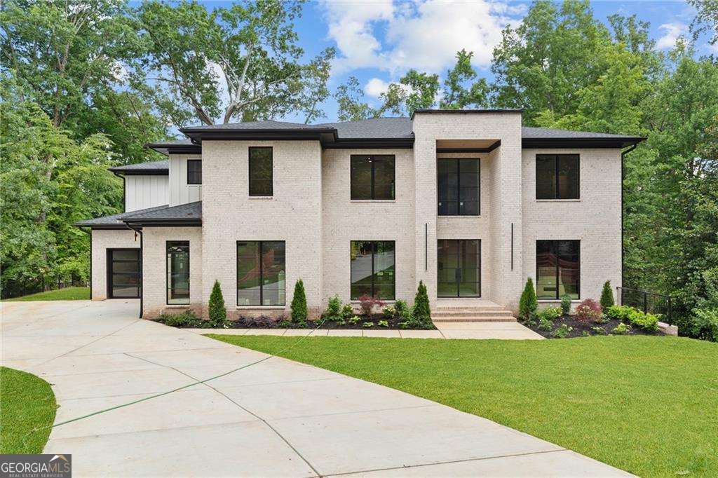 Welcome to a timeless new construction home in the heart of Brookhaven-where elegance meets functionality. Set on a large landscaped lot with a 3-car garage and an unfinished basement ready for future customization, this 5-bedroom, 5.5-bath residence is flooded with natural light and thoughtfully crafted details. Step inside to a grand foyer that leads to a private study and an expansive dining room that comfortably seats 12+. The main level also features a guest suite with a full bath, a separate powder room, and a custom mudroom. The heart of the home is a designer kitchen outfitted with top-of-the-line appliances, a sunny breakfast room, and a hidden scullery-perfect for entertaining. The kitchen flows seamlessly into the inviting family room with a cozy fireplace and backyard views. Upstairs, a spacious media room with trey ceilings offers endless possibilities. The oversized owner's suite is a luxurious haven with a private sitting area, his and hers walk-in closets, and a spa-inspired bath complete with double vanities, a soaking tub under skylights, and a separate glass shower. Three additional ensuite bedrooms and an upstairs laundry room complete the upper level. Enjoy peaceful mornings and cozy evenings on the covered patio with a walk out backyard and outdoor fireplace-ideal for future pool! Located minutes from top-rated schools, shopping, dining, parks, and major highways, this exquisite Brookhaven home offers sophisticated living in an unbeatable location.