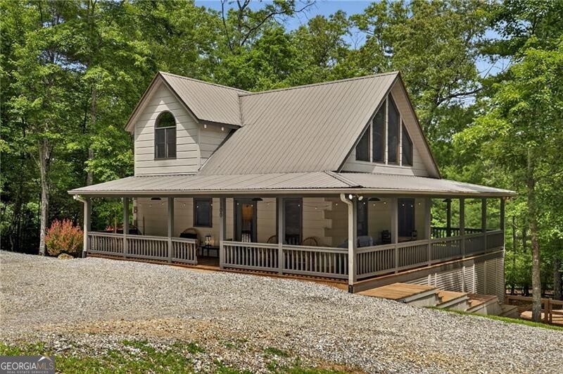 Turn-Key Log Cabin Retreat in the "Aska Adventure Area" - Fully Furnished & Rental-Ready! This beautifully maintained 3BR/3BA log cabin offers the perfect balance of rustic charm, modern amenities, and strong investment potential. Located off the scenic Aska Road in the heart of North Georgia's Chattahoochee National Forest, this property is freshly painted (Spring 2025) and ready for its next chapter. The spacious, open-concept layout includes three full bedrooms and three full bathrooms, with a main-level bedroom and bath for convenience. A versatile loft area with an additional bed makes a great office or lounge space. Enjoy thoughtful features throughout, including a lower level game room with a pull-out couch, stainless steel appliances, two fireplaces, vaulted ceilings, ample storage, a whole-home water filtration system, high-speed fiber internet, and a WIFI-enabled smart lock. Outdoor living shines with a wraparound porch, fully fenced backyard, fire pit area, and a concrete slab perfect for a hot tub addition. A detached shed offers added storage or space for hobbies. Situated in a peaceful area, just 5-10 minutes to Toccoa River activities, 25 minutes to downtown Blue Ridge and Lake Blue Ridge, and approximately 2 hours from Atlanta, this mountain getaway is the perfect blend of privacy and accessibility. Whether you're seeking a full-time residence, vacation home, or income-generating rental, this well-appointed cabin checks every box. *No HOA fees or rental restrictions apply. *Easily accessible year-round with a low-incline, mostly flat paved route all the way to Black Oaks Road-no four-wheel drive needed.