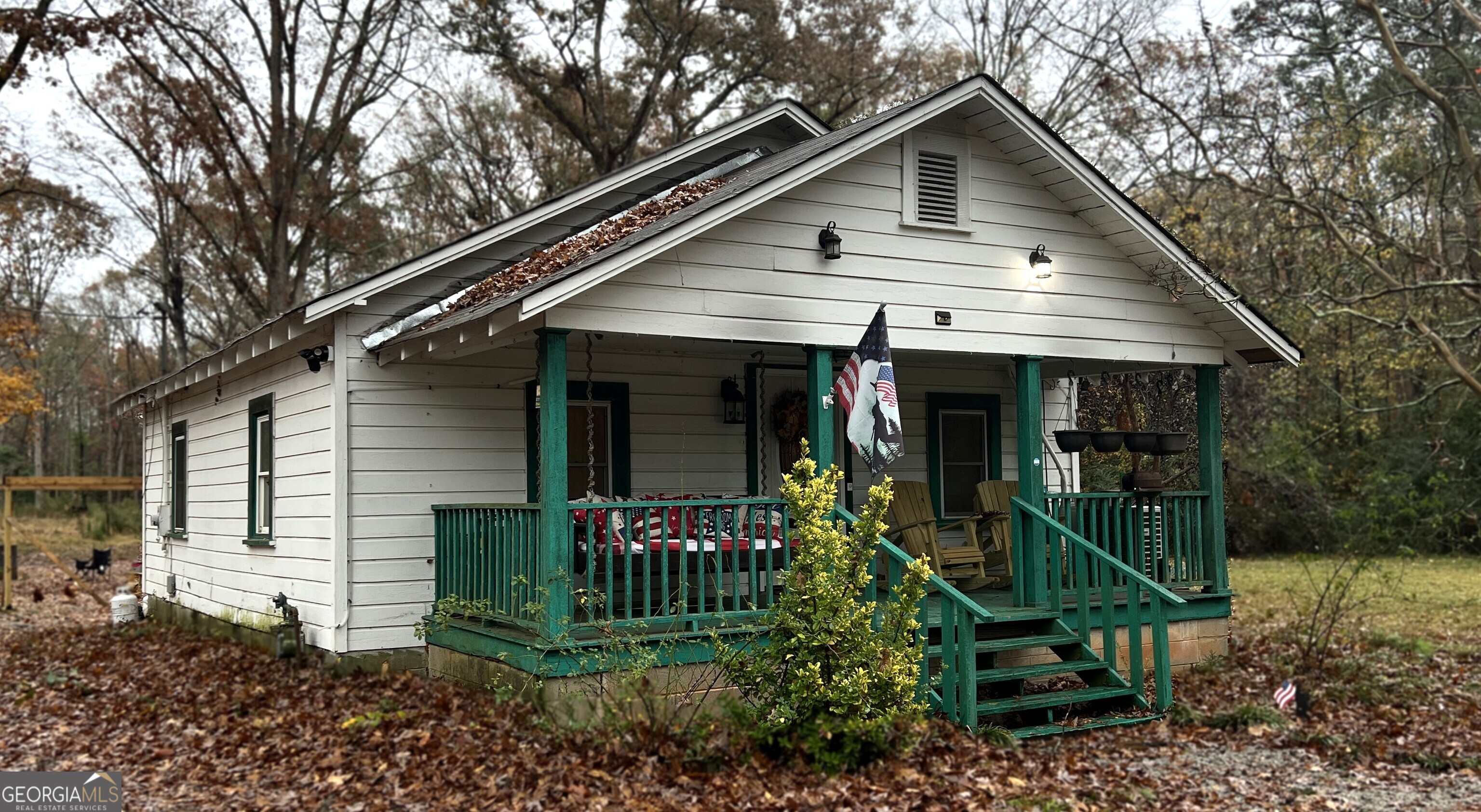 **ACREAGE** Beautiful 19 acres with 1000 sqf cottage that has been partially renovated. 1 Bed, 1.5 baths, new split heating and ac system recently installed, tankless water heater. Work shed in back, plenty of parking incuding RV parking. This is a great location! Sold **As Is**