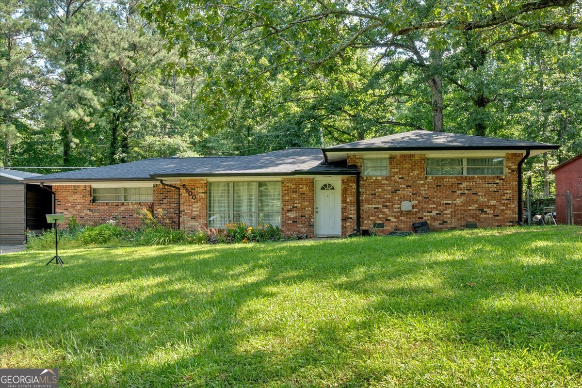 This is the one that stops the scroll! Located just minutes from I-20 and an easy drive into downtown Atlanta, 6600 N Beulah Road offers the best of suburban living without sacrificing convenience. You'll love coming home to this peaceful retreat on a quiet dead-end street-no thru traffic, just calm surroundings and wide-open space. This 3-bedroom brick ranch sits on a nearly half-acre lot with no HOA, giving you the freedom to live how you want. Bring the RV, the boat, or your weekend toys-there's a dedicated RV hookup already in place and plenty of room to park it all. Whether you're gardening, entertaining, or just enjoying the big backyard, this property offers the space and flexibility you've been looking for. Inside, you'll be pleasantly surprised by the generous room sizes-each bedroom offers plenty of space to stretch out, and the massive living room is perfect for movie nights, game days, or hosting friends and family. This home gives you the comfort and functionality you need with room to grow. Major updates like a 2021 roof and updated central HVAC system mean you can move in with confidence, knowing the big-ticket items are already handled. Whether you're a first-time buyer, downsizer, or investor, this property checks every box: affordable, spacious, private, and incredibly well-located. Opportunities like this-close to Atlanta and loaded with extras-don't last long. Come experience the charm of 6600 N Beulah Road today before someone else beats you to it!