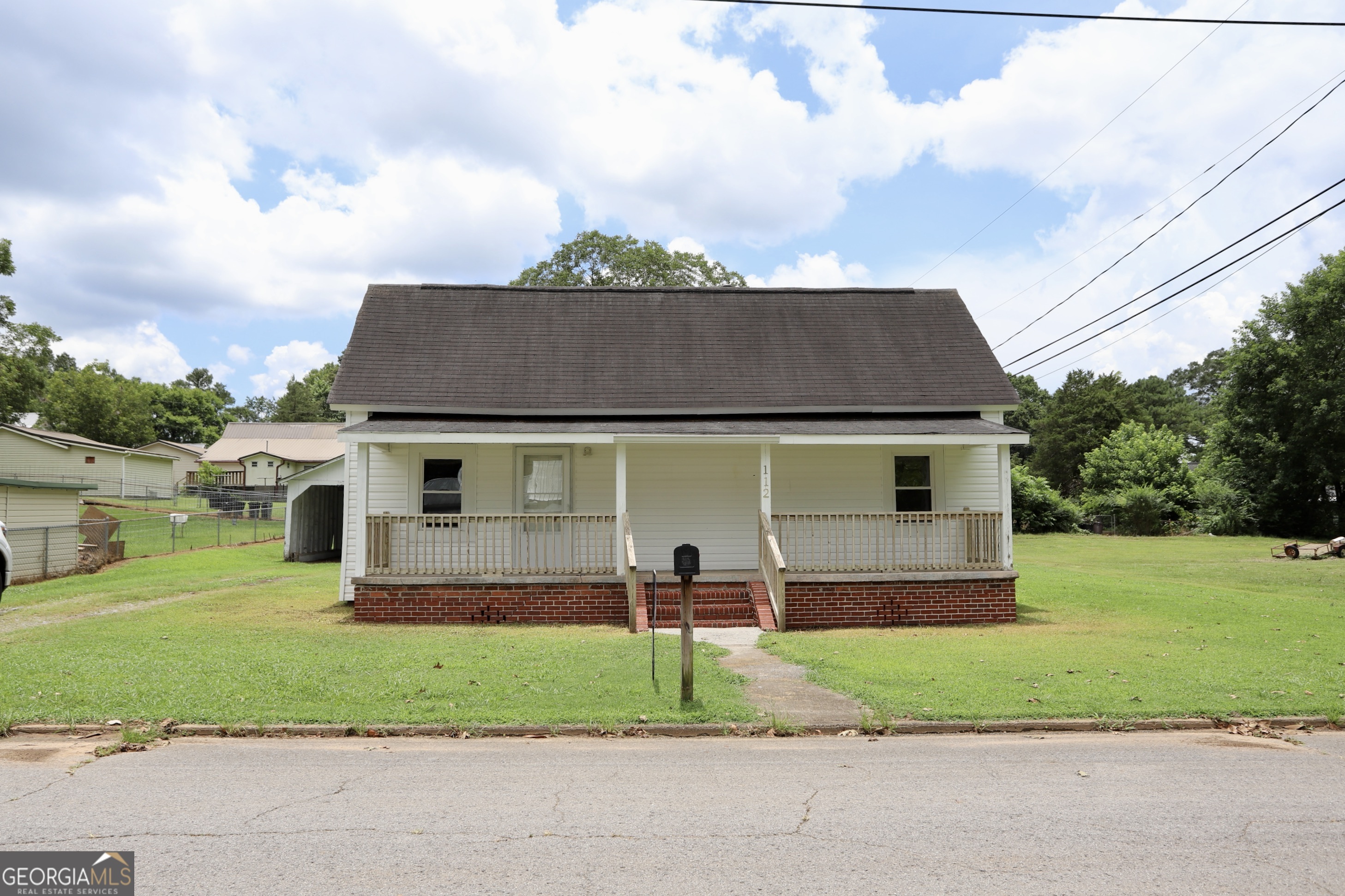 Tons of charm and potential await at 112 Seventh Street in Trion, GA! This 3-bedroom, 2-bath home offers 1,224 square feet of comfortable living space. Each bedroom includes its own closet, providing plenty of storage. Inside, you'll find soaring ceilings, a beautiful kitchen, and a spacious living room perfect for gathering with friends and family. The 0.22-acre lot is grassed and includes a convenient carport with an attached storage shed. Whether you're looking for your first home or a smart investment, this property is ready for its next chapter!