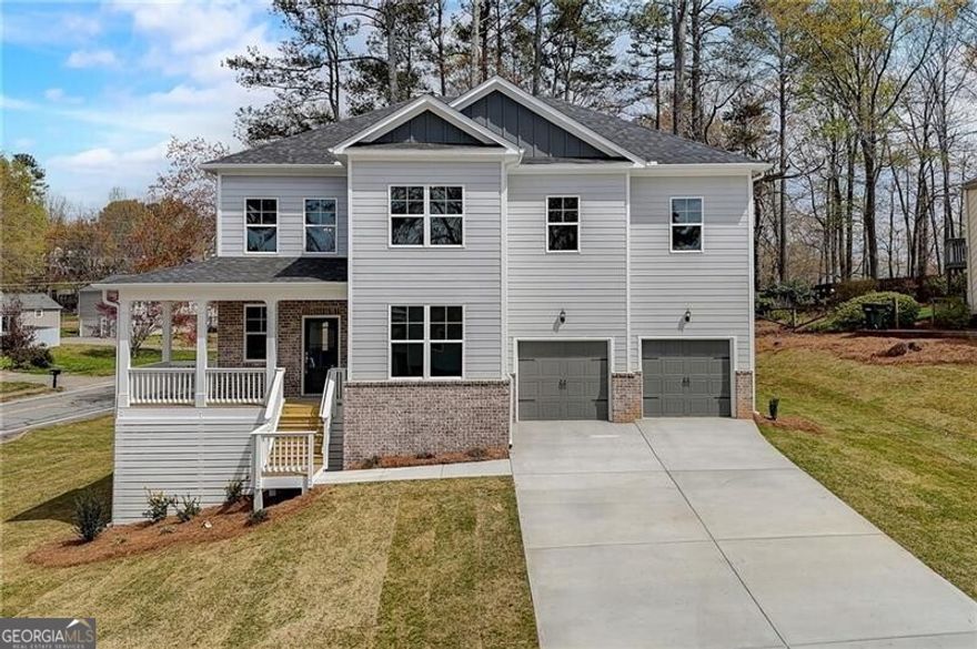 Price reduction! Amazing opportunity to own a spacious new home with a basement in Pope High School district priced for $850,000! This 4-bedroom gem on a corner lot boasts two bonus rooms and a full daylight basement ready to fulfill all your lifestyle needs.  From the inviting front porch to the elegant 2-story foyer, every detail of this home exudes warmth and comfort. The open floor plan with high ceilings creates an airy ambiance that is perfect for both entertaining and everyday living. A bonus room on the main floor is perfect as office or living room. The chef's kitchen is a culinary paradise with ample storage and a walk-in pantry, making meal prep a breeze. Entertain guests in style with a separate dining room for special occasions or unwind in the cozy family room with a gas fireplace. Step outside to the deck overlooking the expansive side and backyard, creating an ideal setting for outdoor gatherings.  Upstairs, discover 4 bedrooms and another bonus room ideal for relaxation or entertainment. With a master bedroom that defines luxury and convenience with its tray ceiling and adjacent laundry room, you'll find solace in the oversized tiled shower with bench and his/her sinks in the master bathroom. One bedroom flaunts its full bathroom while two others share a full bathroom with double sinks.  But wait, there's more! The possibilities are endless with a full daylight basement ready for your personal touch - envision the perfect in-law suite, gym, or home theater. Plus, top-notch Marietta schools make this the ultimate dream home. INCENTIVES FOR USING PREFERRED LENDER