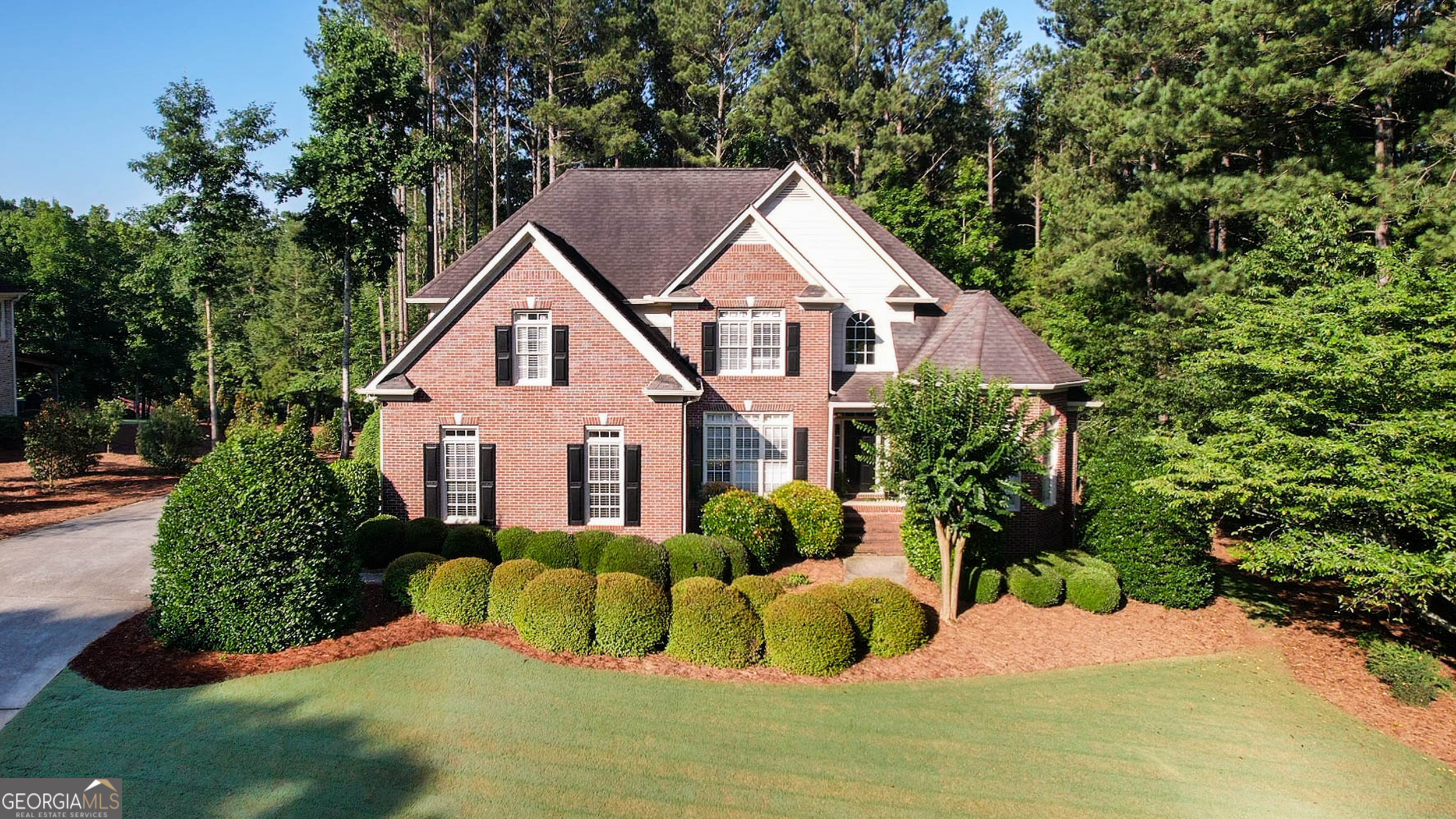 Live Large in the Heart of Oconee! This beautiful 5 bed, 5 bath home in the sought-after Boulder Springs neighborhood sits on a lush 1.01-acre lot just minutes from downtown Watkinsville, Athens, top-rated schools, restaurants, and shopping. Inside, a two-story foyer welcomes you into a bright, open floor plan with vaulted ceilings, hardwood floors, and a formal dining room with elegant wainscoting. The heart of the home is the chefs kitchen, featuring granite countertops, a tiled backsplash, center island, and breakfast nook with panoramic views of the massive backyard perfect for morning coffee or entertaining on the oversized deck. The main-level primary suite is a true retreat, offering two walk-in closets, space for a sitting area, and a spa-like en suite bath. A second bedroom on the main floor makes an ideal guest room or in-law suite. Upstairs, youll find three spacious bedrooms, two full baths, and plenty of closet space. The partially finished basement is a dream with built-in bunkbeds, a playroom/lounge area, and tons of storage. Backyard privacy is guaranteed thanks to the adjacent conservation area, and the location couldnt be better just steps from the community pool, clubhouse, tennis courts, and a fully stocked fishing pond. This one has it all space, style, serenity, and an unbeatable location. Come see why Boulder Springs is more than a neighborhood... its a lifestyle.