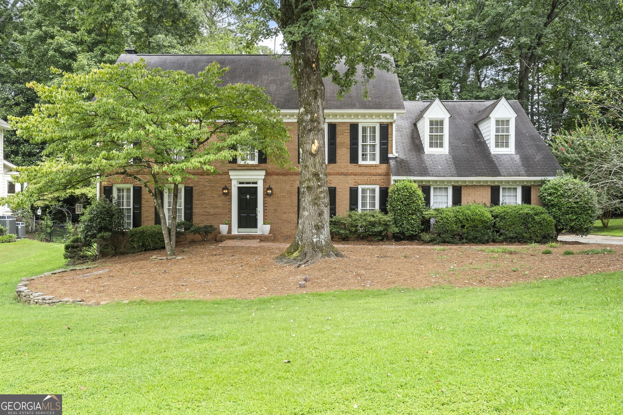 This classic, elegant brick home is nestled in a quiet cul de sac in coveted The Branches neighborhood in Dunwoody! With ample natural light, this floorplan with four bedrooms and a finished basement offers great flow for entertaining and a place for everyone. Updated designer finishes throughout, gleaming hardwoods, huge primary suite with double vanity and walk in closets.Off the eat-in kitchen is a large, charming screened porch with walk-out backyard that is partially flat grass and partially wooded, full of potential and room for a firepit or pool! The Branches has an optional swim/tennis club you can join and close to prime restaurants, shopping, Dunwoody Village and everything Atlanta has to offer. Do not miss this timeless architectural gem with huge yard!