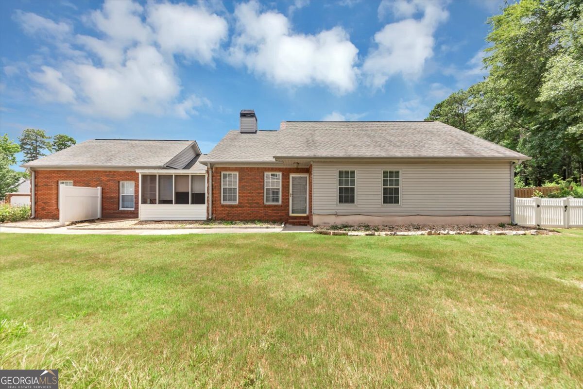 REDUCED! Don't miss this adorable home nestled in the heart of Fayetteville in the prominent Woodgate Subdivision! This beautifully maintained 3-bedroom, 2-bathroom home offers comfortable living in a vibrant community with sidewalks, a pool, tennis courts, and a friendly neighborhood atmosphere, this home is perfect for those seeking both comfort and convenience. This move-in-ready handicap accessible home features a spacious layout, ideal for both relaxing and entertaining. Enjoy a bright and airy living area, a spacious dining room, a eat in kitchen with a breakfast area, a quaint and peaceful sunroom and generously sized bedrooms, including a primary suite with a newly renovated private bath featuring dual vanities and a large walk-in shower. Whether you're a growing family, first-time homebuyer, or looking to downsize without sacrificing comfort, this home offers the perfect blend of space, convenience, and tranquility. Home is located to nearby shopping centers, popular eateries and 30 minutes from Hartsfield Airport. **Homes is eligible for 100% financing** Contact me to learn!!