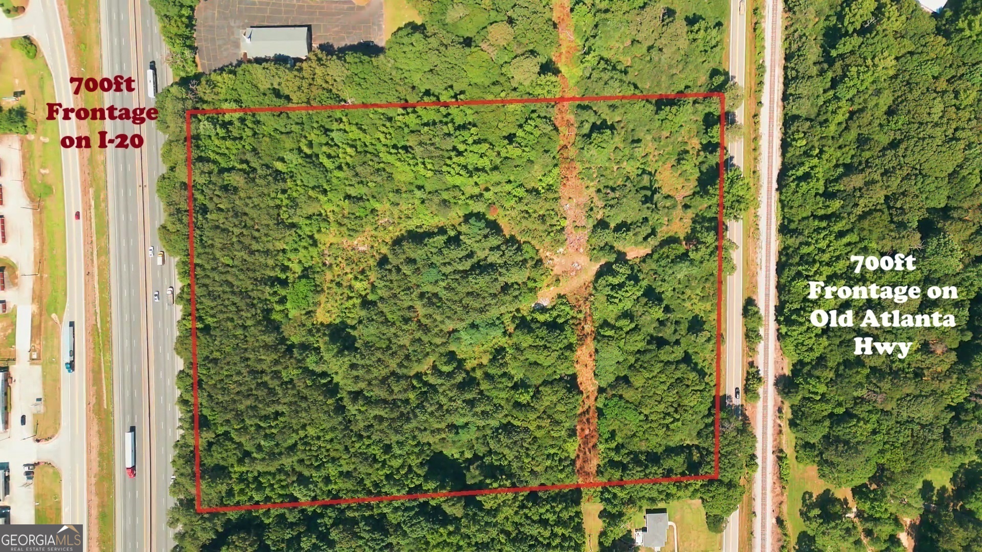 Prime Industrial Land with I-20 Frontage - Ideal for Logistics, Trucking, or Heavy Equipment Storage 10651 Old Atlanta Highway, Covington, GA - 13.28 Acres | Industrial Zoning | $4,000,000 Unlock a rare opportunity to own 13.28 acres of strategically located industrial land with prime visibility and access to Interstate 20. This expansive property is ideal for businesses that require easy highway access, ample outdoor storage, and minimal dependency on municipal sewer infrastructure. Key Features: 700 Feet of Frontage on I-20 & Old Atlanta Hwy - Maximum visibility for trucking, logistics, and industrial operations. Industrial Zoning - Approved for a variety of uses, including trucking terminals, heavy equipment storage, concrete/asphalt plants, and specialized manufacturing. No Sewer Hookup Required for Many Uses - Perfect for operations relying on minimal wastewater needs or on-site treatment solutions. Easy Access to Metro Atlanta & Major Transportation Routes - Just minutes from major distribution centers and industrial hubs. Ideal for: Trucking & Logistics Hub - Utilize the space for fleet storage, maintenance, or a regional trucking terminal. Heavy Equipment Storage & Construction Operations - Secure a prime location for pipeline, utility, or large-scale equipment staging. Concrete, Asphalt, or Aggregate Plant - Capitalize on the industrial zoning and open acreage for materials processing. Specialized Manufacturing - Food processing, distilleries, or niche production with self-sufficient wastewater management. With limited industrial land available along I-20, this property offers a high-value investment for buyers who need space, access, and zoning flexibility. Don't miss this rare chance to establish your business in a prime logistics corridor! Contact us today to discuss how this property can meet your industrial needs. If you want to walk the land, that is by Appointment ONLY. Thank you.