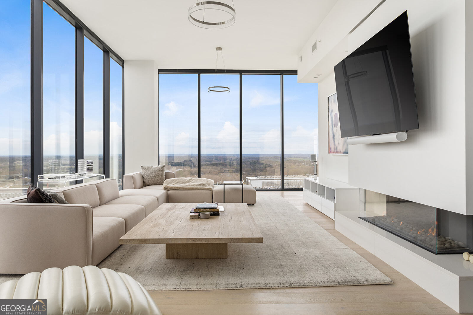 Welcome to this LUXURY FURNISHED PENTHOUSE with unparalleled views and location in the heart of West Midtown. This 4 year young TOP FLOOR 2 BR/3 Full BA 2,369 square feet unit includes a Flex Space perfect for a home office, den or workspace which could also easily be converted into a 3rd Bedroom when purchased. 12' tall ceilings provide a grand sense of space with floor-to-ceiling windows on every exterior wall bathing the home in natural light and providing sweeping, panoramic views of the city and westside Atlanta. A European-style kitchen is brought to life with modern soft-close custom cabinetry with undermount lighting, quartz countertops with a waterfall center island which seats 4, tile backsplash and stainless steel Kitchen Aid and Whirlpool appliances including a separate beverage center for wine, beer or other libations. A dining area with a large wrought-iron double tiered chandelier is located directly off of the kitchen with access to the exterior balcony. The thoughtfully designed open concept living space combined with high end furnishings and art mixes Old World and New World aesthetics making this an entertainer's dream while also inviting ease and relaxation for everyday living. Beautiful designer finishes throughout include wide plank LVP floors, a designer lighting package including upgraded fans, and a remote controlled sleek linear fireplace. Multiple high definition flat screen TV's are mounted conveniently throughout including the primary living space, owner's suite and kitchen. The spacious owner's suite features views of downtown and has a large walk-in closet. The owner's bath features oversized tile flooring, a double vanity with quartz countertops, an LED mirror, walk-in glass surround shower and modern soaking tub. The spacious secondary bedroom with views of the westside includes a walk-in closet and ensuite bathroom with oversized tile flooring, an LED mirror and a tub/shower combo. The 3rd full bathroom located near the entry foyer features the same high end finishes. Additional features of this top-floor penthouse include a convenient walk-in laundry room with oversized tile flooring and front loading LG washer and dryer, ample storage space in multiple closets throughout the unit and 2 deeded parking spaces. Seven88 stands apart in this historic post-industrial district only minutes from Atlanta's best restaurants, retail and entertainment. Extraordinary amenities include a gated parking garage, 24-hour concierge, saltwater pool & whirlpool spa, fitness & yoga center, outdoor grilling areas, club room with demonstration kitchen, billiards and lounge, bike storage, and smart delivery lockers with cold storage for food deliveries. Also listed For Sale for $1,425,000 FMLS#7591612. The Property is currently leased and will be available for showings starting July 10th.