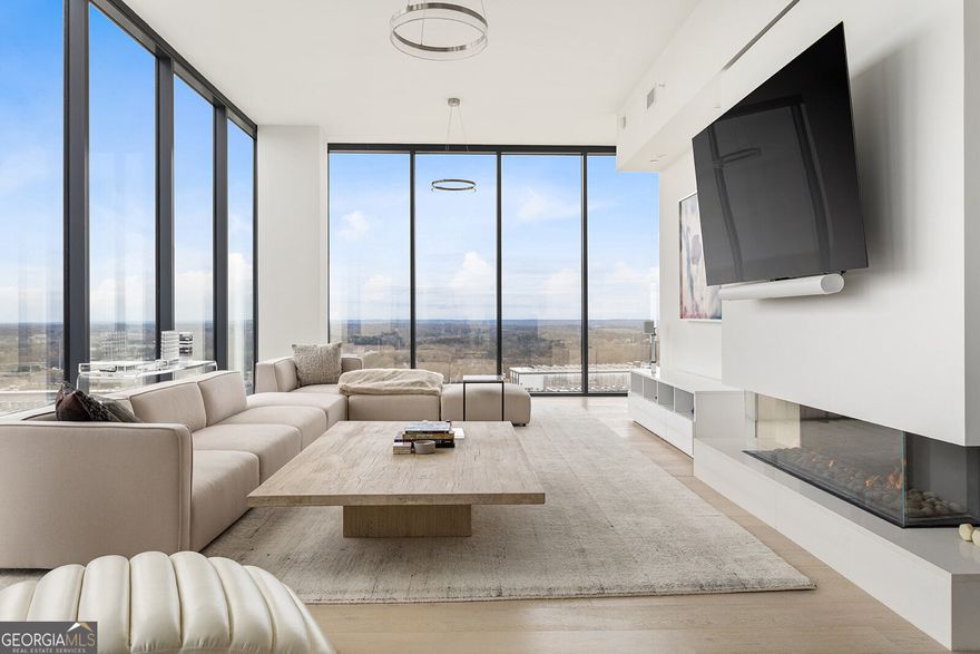Welcome to this LUXURY FURNISHED PENTHOUSE with unparalleled views and location in the heart of West Midtown. This 4 year young TOP FLOOR 2 BR/3 Full BA 2,369 square feet unit includes a Flex Space perfect for a home office, den or workspace which could also easily be converted into a 3rd Bedroom when purchased. 12' tall ceilings provide a grand sense of space with floor-to-ceiling windows on every exterior wall bathing the home in natural light and providing sweeping, panoramic views of the city and westside Atlanta. A European-style kitchen is brought to life with modern soft-close custom cabinetry with undermount lighting, quartz countertops with a waterfall center island which seats 4, tile backsplash and stainless steel Kitchen Aid and Whirlpool appliances including a separate beverage center for wine, beer or other libations. A dining area with a large wrought-iron double tiered chandelier is located directly off of the kitchen with access to the exterior balcony. The thoughtfully designed open concept living space combined with high end furnishings and art mixes Old World and New World aesthetics making this an entertainer's dream while also inviting ease and relaxation for everyday living. Beautiful designer finishes throughout include wide plank LVP floors, a designer lighting package including upgraded fans, and a remote controlled sleek linear fireplace. Multiple high definition flat screen TV's are mounted conveniently throughout including the primary living space, owner's suite and kitchen. The spacious owner's suite features views of downtown and has a large walk-in closet. The owner's bath features oversized tile flooring, a double vanity with quartz countertops, an LED mirror, walk-in glass surround shower and modern soaking tub. The spacious secondary bedroom with views of the westside includes a walk-in closet and ensuite bathroom with oversized tile flooring, an LED mirror and a tub/shower combo. The 3rd full bathroom located near the entry foyer features the same high end finishes. Additional features of this top-floor penthouse include a convenient walk-in laundry room with oversized tile flooring and front loading LG washer and dryer, ample storage space in multiple closets throughout the unit and 2 deeded parking spaces. Seven88 stands apart in this historic post-industrial district only minutes from Atlanta's best restaurants, retail and entertainment. Extraordinary amenities include a gated parking garage, 24-hour concierge, saltwater pool & whirlpool spa, fitness & yoga center, outdoor grilling areas, club room with demonstration kitchen, billiards and lounge, bike storage, and smart delivery lockers with cold storage for food deliveries. Also listed For Sale for $1,425,000 FMLS#7591612. The Property is currently leased and will be available for showings starting July 10th.