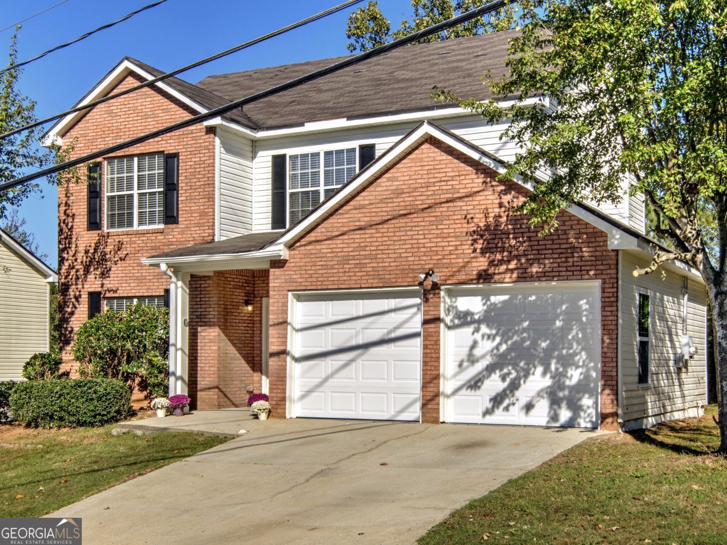 PRICE REDUCTION!! Come and view one of Lithonia's hidden gems in the quiet neighborhood of Cutters Mill! This stunningly renovated 3-bedroom, 2.5-bathroom home seamlessly blends modern elegance with natural warmth. Bathed in sunlight, the open floor plan invites you to enjoy the living area, complete with a cozy fireplace for those intimate gatherings. Retreat to the expansive master suite, featuring a luxurious double vanity and a serene garden tub. With a two-car garage and nearly half an acre of outdoor space, this property offers both comfort and room to grow!