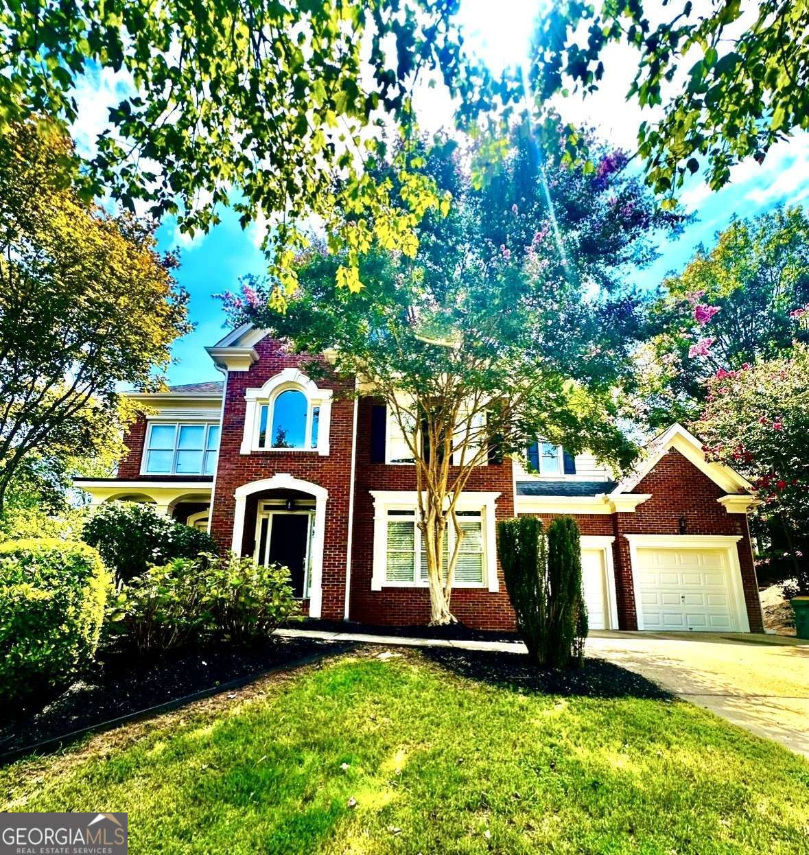 Spacious Executive Home in East Cobb's highly sought after Christopher Robbins Neighborhood! This large home features 6 bedrooms & 5 full bathrooms with oversized living spaces. Enter through the grand 2-story foyer entryway leading to a versatile formal dining & formal living or flex space for office. The foyer leads into the light-filled dramatic soaring ceilings in the family room with stone surround gas fireplace with floor to ceiling windows. The family room flowing seamlessly into the heart of the home-The kitchen, which features abundant white cabinetry, gas cooktop, double ovens, walk-in pantry, sleek stone countertops, center island with additional seating. Adjacent to the kitchen is a spacious breakfast area offering serene views of the backyard. The main floor also features a guest bedroom suite and full ensuite bathroom. Venture upstairs and you'll find an Expansive primary suite with light-filled seating area with a fireplace & relax in the luxurious spa bathroom with a jetted soaking tub, separate shower, private water closet, and an oversized walk-in closet. This thoughtfully designed home offers 3 more large secondary bedrooms upstairs with two split-bedroom layout sharing a Jack and Jill bath plus 1 more bedroom with its own full ensuite bathroom. The finished terrace level In-Law Suite features a Full Kitchen & Bath, Bedroom, Living Area, Separate Washer/Dryer and Private Driveway & separate garage access. This home has been refreshed with Fresh Interior Paint & New Carpet. This Beautiful Stately Home sits on a Large corner lot on quiet cul-de-sac with fenced backyard. Enjoy easy access to neighborhood amenities, including a playground, clubhouse, a pristine pool, and tennis courts for staying fit and social. If you need space, this is the home for you. Come see this Gem for yourself.