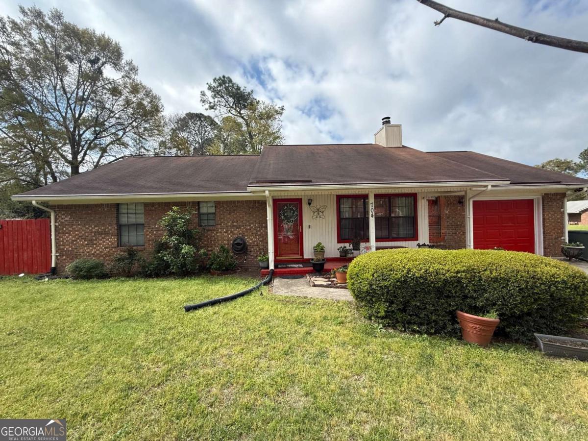 This lovely 3-bedroom, 2-full-bath rental property has been meticulously cared for! The garage has been partially converted with added heat and AC so that you can set up a home office, playroom, or separate retreat on the farthest side of your new rental! Bright and cheery colors can be found inside this rental, so that you can come home and unwind! A massive living room with a fireplace welcomes you home, and the oversized kitchen with a multitude of cabinet storage is a focal point for gatherings and entertaining, with stainless steel appliances ready to help you create any meal you may desire! Off the kitchen, you'll find the cutest laundry room nook, complete with upgraded glass pantry entry, and a bonus half bath, just off the garage area! The most interesting feature of this property may be the mounted solar panels that were installed to optimize energy consumption. Ask at our office to see how some of your power bills may end up being only Zero dollars per month, at no cost to you! This beautifully landscaped yard is a must-see, and this rental is located immediately outside of the Main Gate of Fort Stewart, and is also convenient to loads of shopping and dining! Our office requires a minimum credit score and verifiable income to apply for any of our properties. Plan to show us your score using your free credit monitoring app, to snag a set of keys to this beautiful rental for a quick walk-through! This property is STRICTLY no pets! Register your Service Animal with Petscreening.com