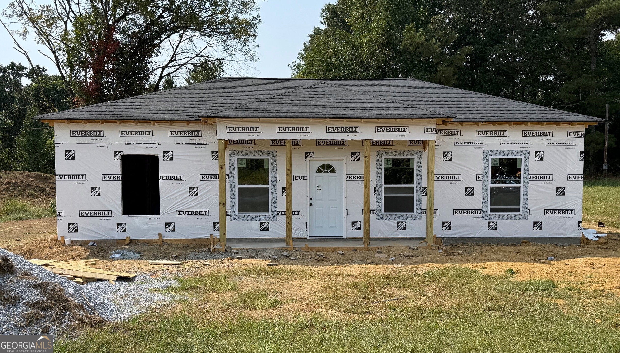 Looking for brand-new construction without the restrictions of a neighborhood or HOA? This single-level home is one of six thoughtfully built in the desirable Coosa area, just 1.3 miles from Coosa High School and only 5 miles from town off Alabama Hwy. The open-concept layout features 9-foot ceilings, a split-bedroom floor plan, and luxury vinyl plank flooring with a 50-year warranty. The kitchen is designed with shaker-style soft-close cabinetry and granite countertops. The primary suite offers a walk-in closet and private bath. Additional conveniences include a laundry room, front porch, and driveway parking. Outside, the finished yard will be sodded landscaping, and the level backyard will be privacy fenced for both curb appeal and outdoor enjoyment. Finished with charming board and batten siding, this home sits on a quiet dead-end street with minimal traffic, offering peace and privacy while still being close to schools, shopping, and everyday amenities. Estimated completion is mid-to-late November.
