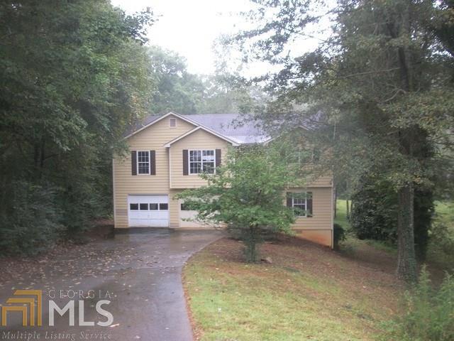 Spacious 3 bedroom/2 bath split foyer home on large cul-de-sac lot with lovely creek. Large family room with fireplace, nice size master bedroom and bath with double vanity, garden tub and separate shower. Drive under 2 garage and basement is partially finished and awaiting your customization. Close to schools, I-985 and Lake Lanier. (No repairs of any kind prior to closing. Sold as is. Please reference docs online: per PCR-plumbing is damaged & utilities might not be approved for turn on. Selling agent to verify all info. FHA insured with escrow-IE. BSCA & Earnest Money guidelines in effect. *Buyer must obtain their own appraisal to secure financing and verify insurability*) Equal Housing Opportunity