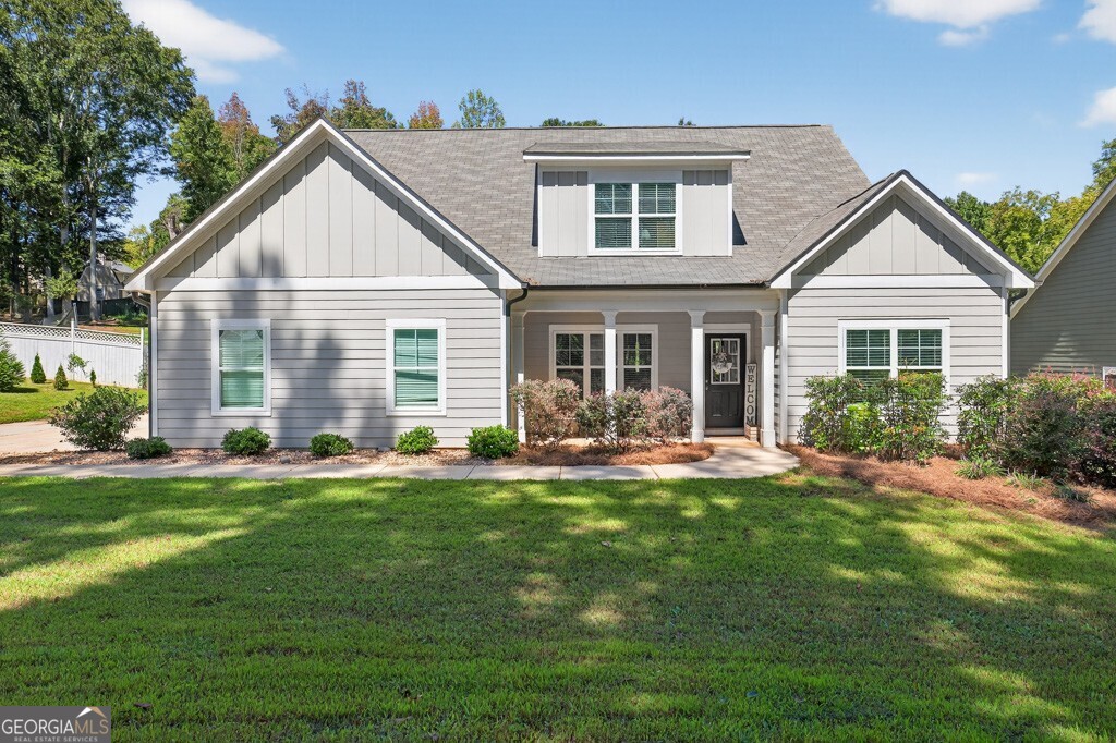 Beautifully designed and well-maintained property located in Winder, Georgia! Boasting four bedrooms and three full baths. There is plenty of space to spread out in this home. Primary and guest suite are located on the main floor, with an additional two bedrooms, one full bath, and a bonus/flex room located upstairs. Recently constructed in 2021, all major components are Less than five years old and are well within their life expectancy. Enjoy a private fenced-in backyard with ample space to play and entertain for hours! Outback, you'll also find an extended patio with a hot tub that will remain with the property, a fire pit ready for those cold night bonfires, and just beyond the fence is a two-story building that can be used for storage or finished to be completed as additional living space. Throughout the interior of the home, you will see several areas that have been designed beautifully and are functional for storage. Take a look today at this amazing property.
