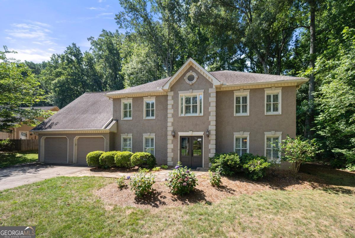 Welcome to this meticulously maintained, move-in ready home in the highly sought-after Windsor Oaks Community, nestled in the heart of East Cobb and served by top-rated schools.The updated kitchen features new flooring, granite countertops, a stylish island, and ample cabinetry, perfect for culinary enthusiasts and a cozy breakfast area that overlooks the beautiful backyard. A cozy brick fireplace in the family room and wood flooring flows throughout the main level complement the home's warm and inviting feel. The large dining room area is perfect for hosting family gatherings. The spacious primary suite includes beautiful hardwood floors, multiple walk-in closets and a renovated bathroom filled with wonderful natural light. Upstairs, you'll find three additional bedrooms along with a versatile bonus room ideal for a home office, playroom, or additional living space. Step outside to a stunning stone patio area that opens to a large, level backyard perfect for entertaining, gardening, or play. A convenient storage shed offers extra space for tools or equipment. Windsor Oaks offers resort-style amenities including four newer tennis courts, a multi-purpose court for pickleball or basketball, two covered pavilions, a spacious pool, and a playground. This vibrant and active neighborhood, with the home located on a quiet street, makes it the perfect place to call home. Don't miss your opportunity to live in one of East Cobb's premier communities!