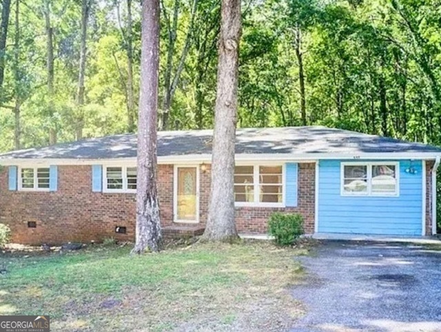 Fall in love with this delightful four-sided brick ranch nestled on a shady corner lot walking distance from the sought-after beautiful downtown Monroe. Whether you're a first-time buyer dreaming of your own cozy space or an investor looking for prime potential-this home checks all the boxes. This beauty features beautiful hardwood floors that bring timeless elegance, a bright welcoming dining area that's perfect for morning coffee or evening laughs, freshly painted interiors and kitchen cabinets along with a flexible layout which includes a possible in-law suite featuring a luxurious jacuzzi tub-relaxation awaits. This level, corner lot is framed by mature trees and is just waiting for the kids, pets and memories. The durable brick exterior means little maintenance and more freedom to enjoy downtown. All of this with walkability to downtown Monroe-shopping, dining, and charm just minutes away. With this Seller offering concessions, don't miss out on this rare find that blends value, style, and location. Reach out today and make this lovely home yours.