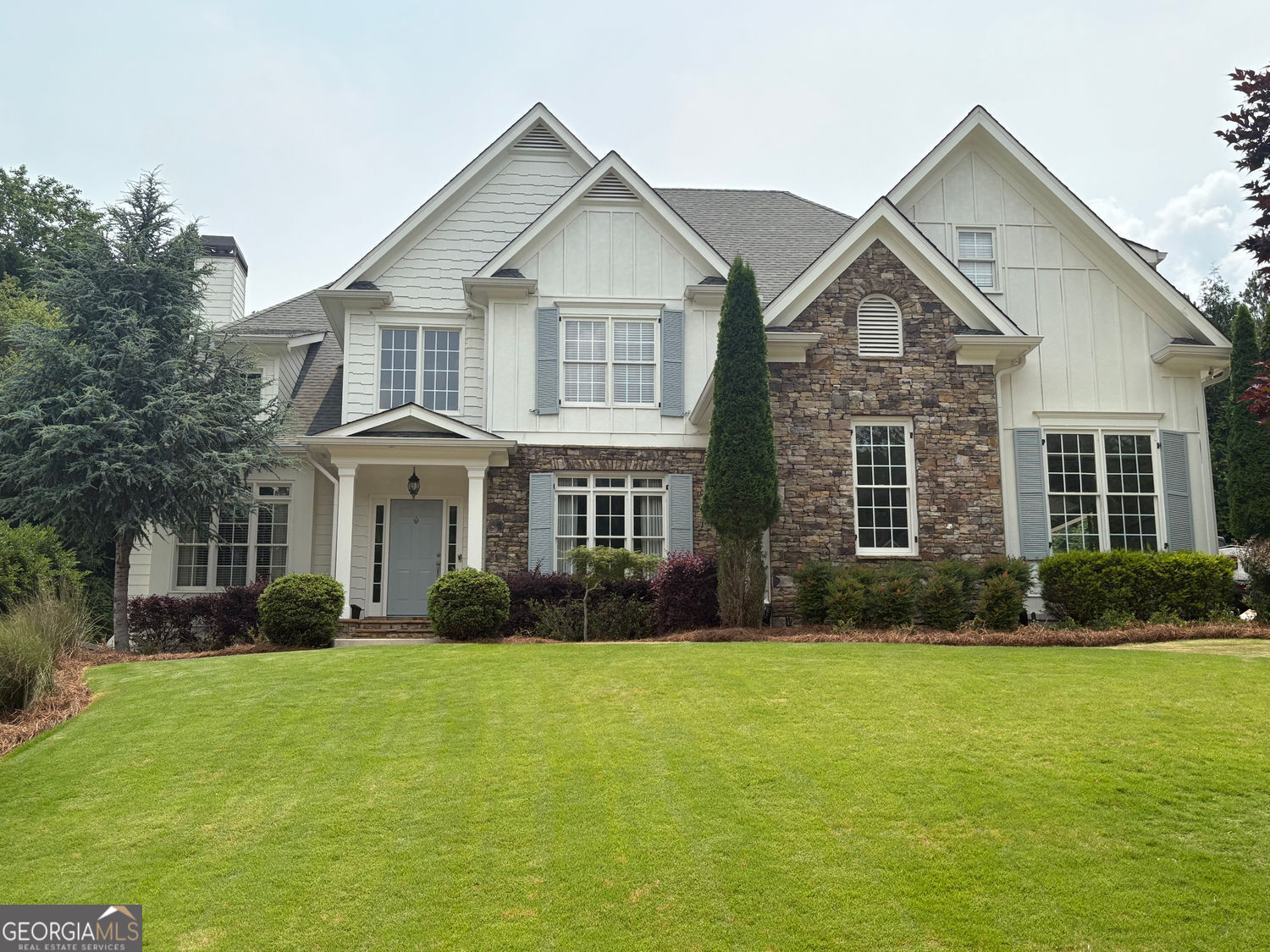 Rare Opportunity in Wild Timber - North Gwinnett Schools | 4BR/3BA | Cul-de-Sac Lot with Private Pool! Welcome to this beautifully updated 4-bedroom, 3-bathroom home on one of the most desirable cul-de-sac lots in Wild Timber, just steps from the Chattahoochee River walking trails. This custom home features an updated white kitchen with quartz countertops, stainless steel appliances, and a stylish backsplash-open to a fireside family room perfect for entertaining. The main level offers a guest bedroom and renovated full bath, along with formal living and dining rooms, a cozy breakfast nook and a family room steps away from a gorgeous pool. Upstairs, find four spacious bedrooms and two fully renovated bathrooms, including a luxurious spa-like owner's suite and a stunning Jack-and-Jill bath. Enjoy summers in your custom built heated saltwater pool with spa, tanning ledge and endless water features, or sit on your covered pool side porch and enjoy the view. The large flat backyard offers infinite opportunities for outdoor entertainment. Expand into the full unfinished basement for endless possibilities. The 3-car garage and extended parking pad provide ample space for guests. Live in a community that offers a swim team, tennis leagues, stocked fishing lake, a cabin-style clubhouse, playground, and scenic trails-all within walking distance. Located along the banks of the Chattahoochee River in the top-rated North Gwinnett school district, this home blends lifestyle, luxury, and location.