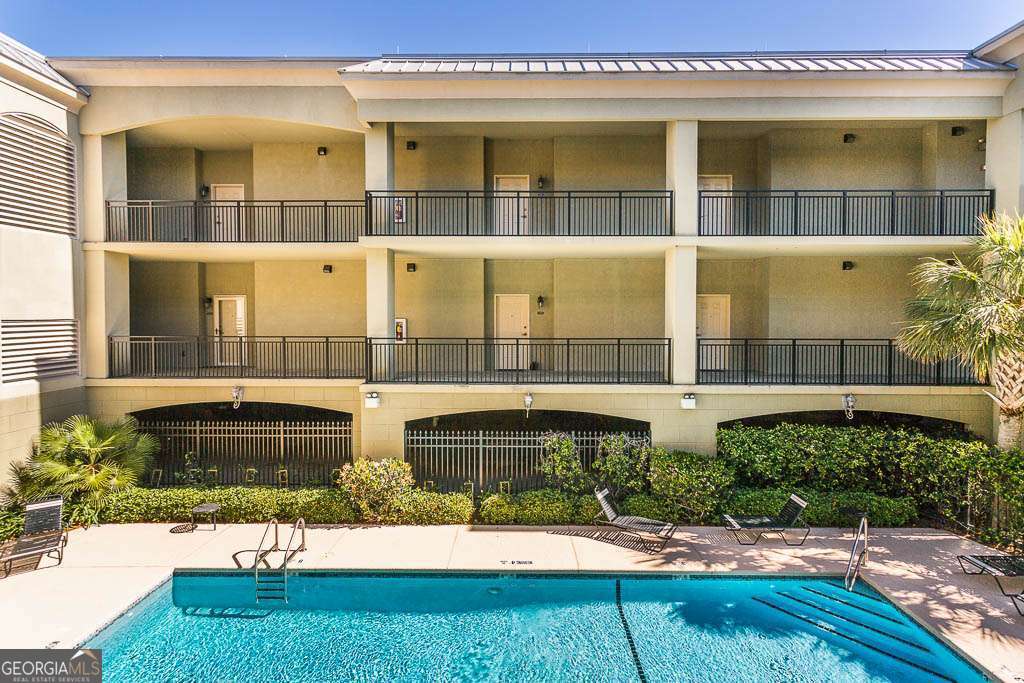 Welcome to this beautifully updated 1-bedroom, 1.5-bath condo located in a highly sought-after, gated community just minutes from the beach, shopping, and dining. This light-filled unit offers an open and inviting floor plan with tile flooring throughout and luxury vinyl plank in the bedroom. The full kitchen features stainless steel appliances, a breakfast bar, and a charming breakfast nook accented with shiplap. The spacious primary suite includes a luxurious ensuite bathroom with a jacuzzi tub, separate tiled shower, dual vanities, and a custom-designed walk-in closet. Enjoy your morning coffee or evening breeze on the private balcony. Additional perks include covered parking, access to community amenities such as a pool and secure entry, and plenty of storage. Please note: A pending HOA assessment for exterior building repairs is in place. The seller is willing to contribute toward the cost. This move-in-ready condo combines comfort, convenience, and coastal living-don't miss this opportunity!