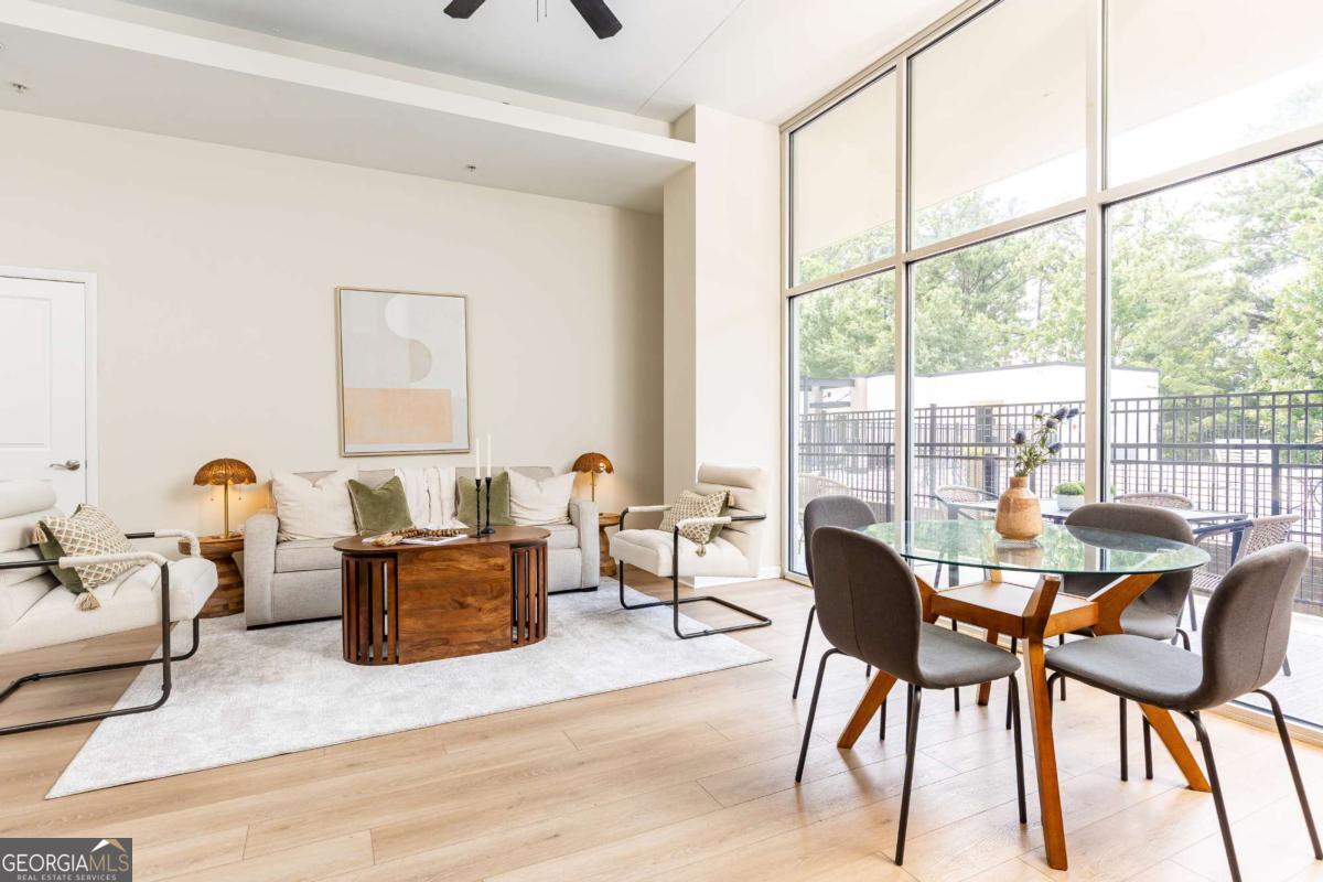 Don't miss out on this prime opportunity to live in one of the most desirable areas! This beautifully updated 2-bed, 2-bath condo offers the perfect blend of modern comfort and unbeatable convenience! Sunlight pours through floor-to-ceiling windows, illuminating the spacious open floor plan and the expansive private balcony-perfect for morning coffee or evening cocktails. This exceptional community offers a on-site fitness center, sparkling pool, dog run, and community garden. Located in the heart of it all in Downtown Chamblee-just minutes from Phipps Plaza & Lenox Square, trendy restaurants, shopping, the open container district, the Rail Trail, and lush parks-this condo is the perfect blend of convenience and luxury.