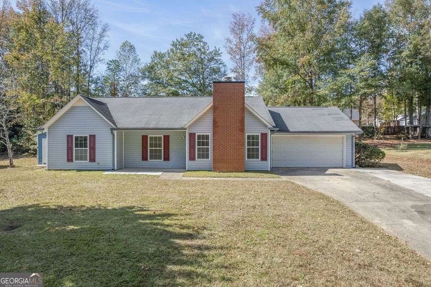 This adorable Ranch Style home is immaculate and located minutes to Shopping and Downtown Newnan.  This 3 Bedroom 2 Bath home is a great floorplan with fabulous upgraded floors, new paint, updated bathrooms, and lighting throughout.  There is a covered back porch and great storage in the workshops.  The home is centrally located to the Elementary and High School and all the amenities of Downtown.  You can even purchase a street legal Golf Cart to ride around the town which makes it even more convenient.  Close and Move in just in time for the Holidays