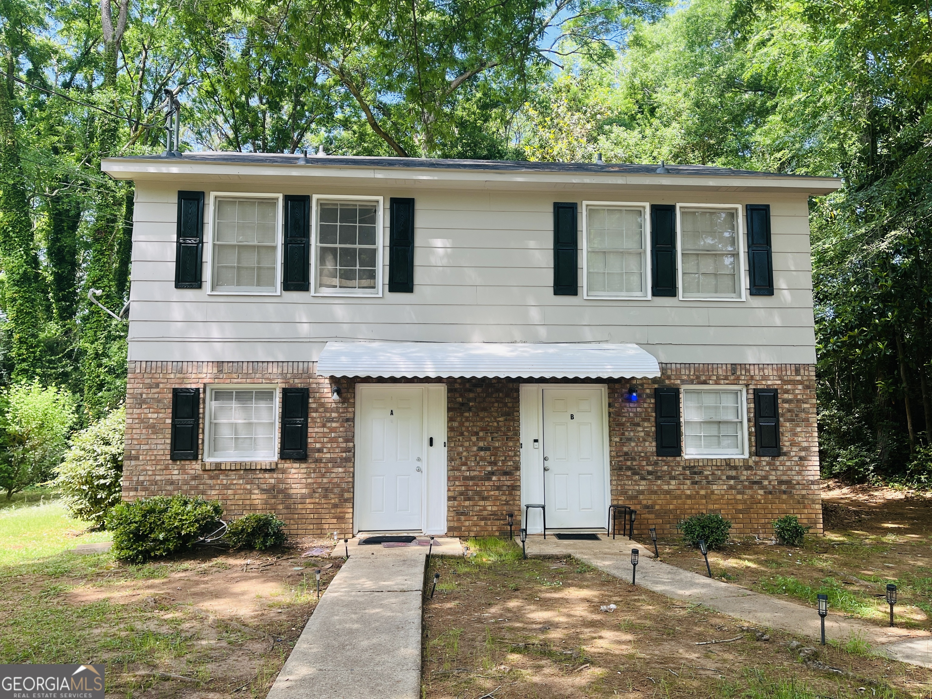 Welcome! Private and wooded setting, close to everything, new LVP flooring, new appliances, private patio, new paint, must see!