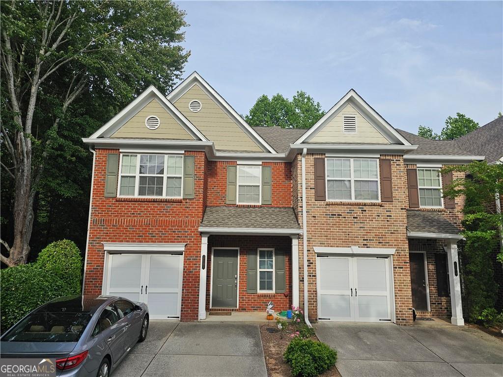 Beautiful End-Unit Townhome in a Gated Community - Prime Duluth Location! Don't miss this fully updated 3-bedroom, 2.5-bathroom townhome offering modern finishes and move-in readiness. Enjoy newer, fresh paint and stylish laminate flooring throughout the entire home. The kitchen features sleek dark countertops and stainless steel double sink, a perfect blend of function and style. The spacious primary suite includes an upgraded bathroom with newer cabinets, a double vanity, and a relaxing soaking tub. Only 4 years old A/C and blend new Water heater and Garbage Disposal. The charming brick facade adds to the home's curb appeal, making a lasting impression. Conveniently located less than 2 miles from all local schools, and just minutes from shopping, grocery stores, restaurants, and I-85 (Exit 108). This home combines comfort, convenience, and community. Schedule your showing today! No Smoking and No pets allowed. HOA covers all exterior maintenance So tenants are free from landscaping etc.