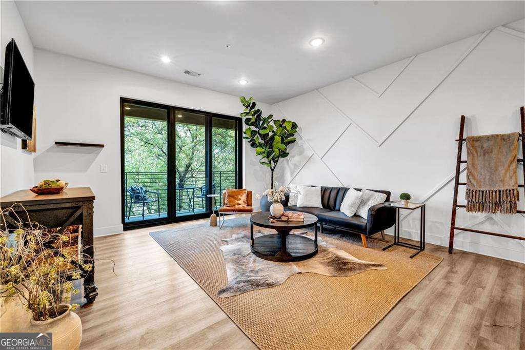 Up to $16,250 in Down Payment assistance available to qualified Homebuyers through Preferred Lender! Modern Boutique Condo in the Heart of Historic Kirkwood! Contemporary and stylish, this boutique condominium offers upscale living with first-class amenities, including a rooftop terrace with turf for cornhole, open-air lounge, grilling station, dual-sided outdoor fireplace, fitness center, and pet spa. Located directly across from the vibrant Pratt Pullman District and just minutes from the Beltline, this home offers the perfect blend of urban excitement and neighborhood charm. Inside, enjoy an open-concept layout with oversized windows that flood the space with natural light. The sleek kitchen features a waterfall island, quartz countertops, and stainless-steel appliances, flowing seamlessly into the spacious living area-ideal for entertaining. This unit includes, a private covered balcony, guest parking, covered assigned parking, washer and dryer, and a luxurious primary suite with a spa-like bath, oversized shower, double vanity, and walk-in closet. Conveniently located near parks, MARTA, and just a 5-minute drive to Downtown Decatur. Schedule your showing today-this one won't last!