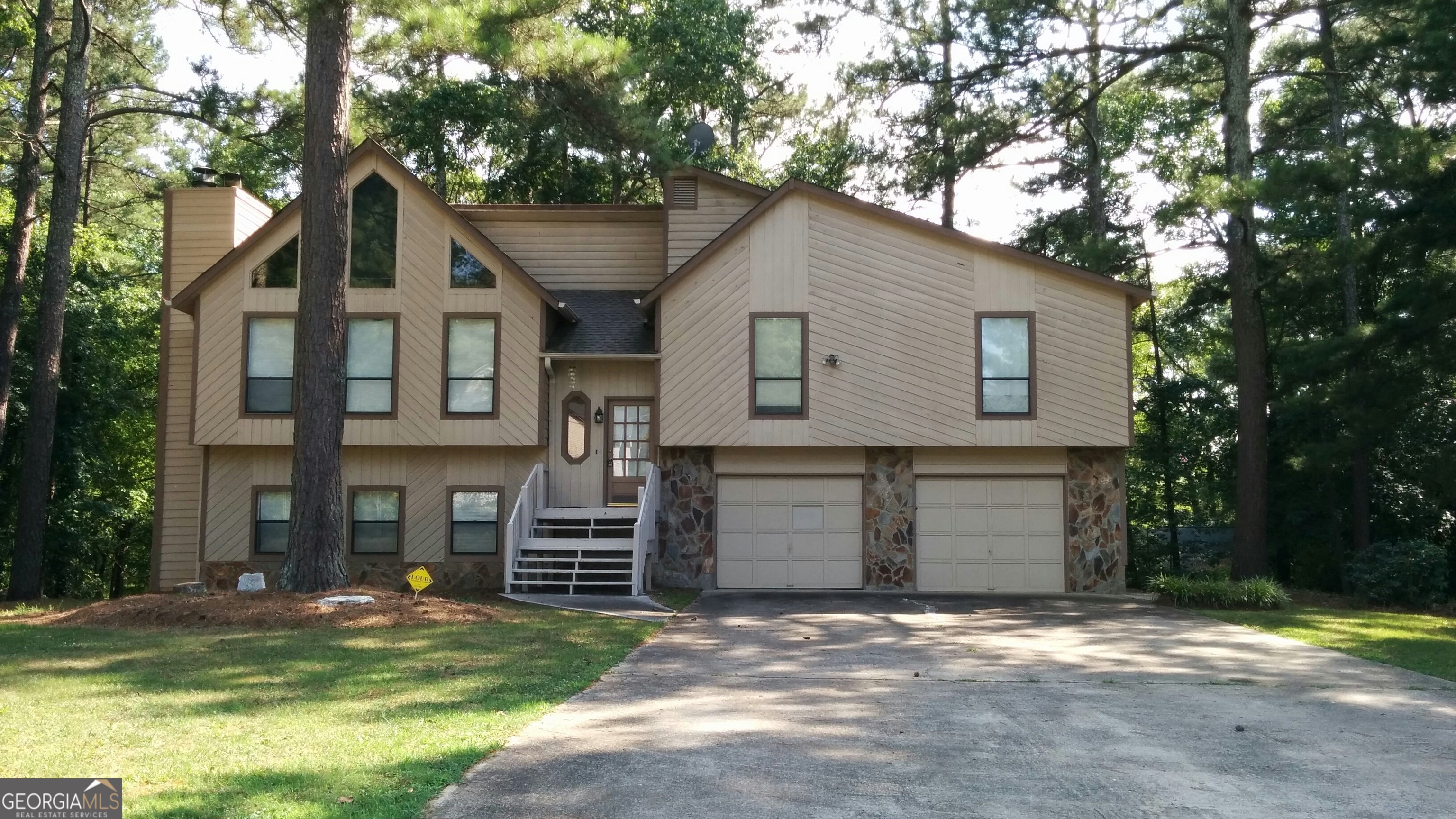 Spacious Split Foyer with In-Law Suite & Rental Potential! 4BR/3BA home featuring 3BR/2BA upstairs and a private 1BR/1BA in-law suite with kitchenette on the lower level-ideal for multi-generational living or rental income. Bonus room off garage can serve as a 5th bedroom, office, or rec space. Enjoy a bright sunroom, large yard, and extended driveway with ample parking. Property has a strong rental history, with recent tenants paying $2,200/month. Conveniently located near restaurants, shopping, Wellstar Cobb Medical Center, and just minutes from I-75 for an easy commute.